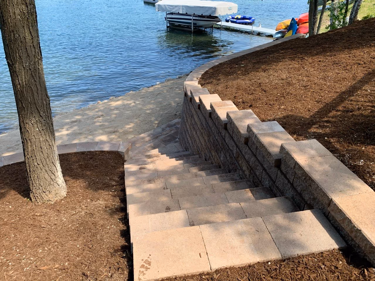 A top-down perspective of the new stone staircase, illustrating the clean lines and safe, durable descent provided from the hillside home down to the Silver Lake shoreline.