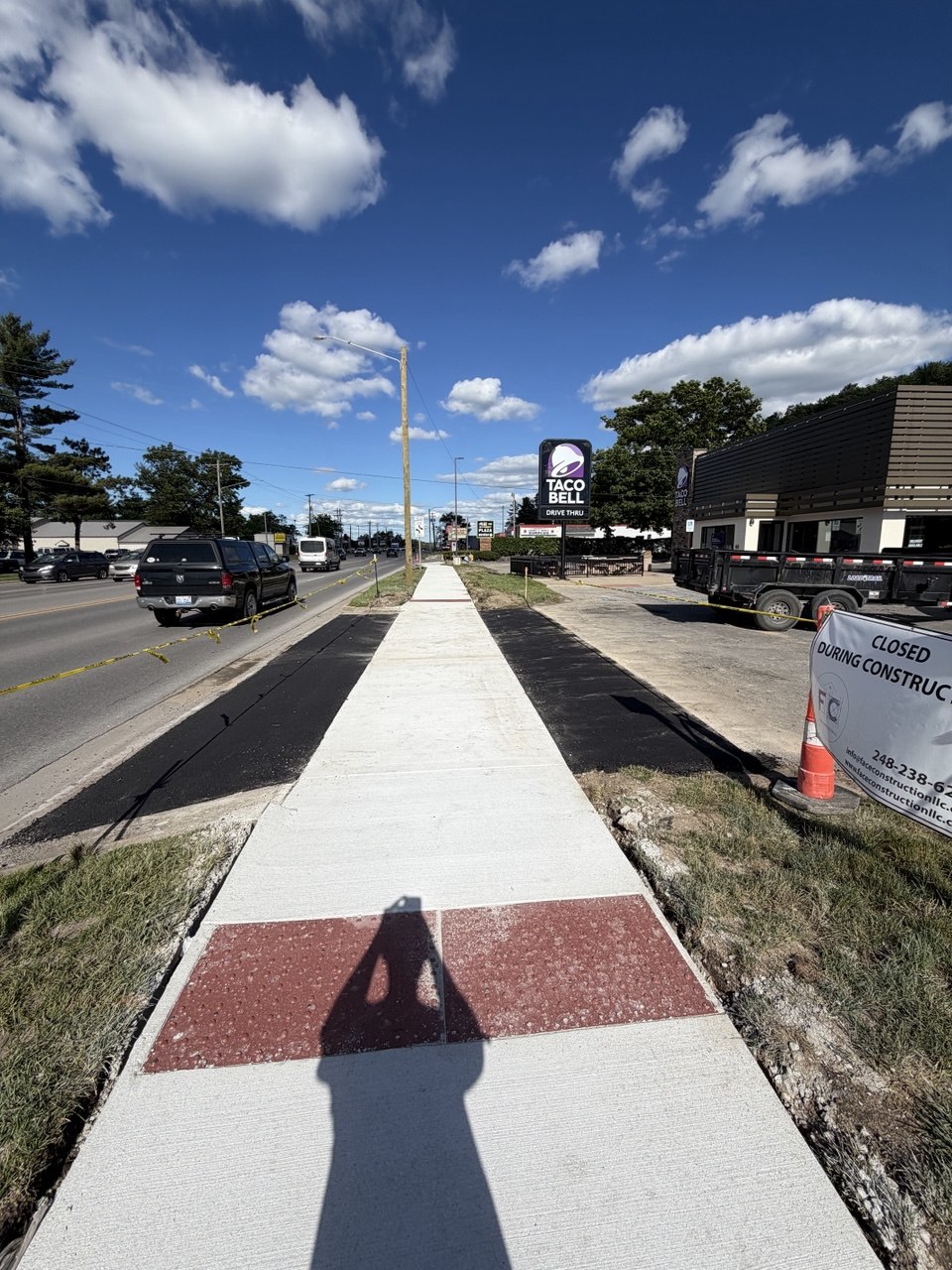 Completed commercial asphalt patch and parking lot repair at Taco Bell on 1447 West South Airport Road in Traverse City, Grand Traverse region.