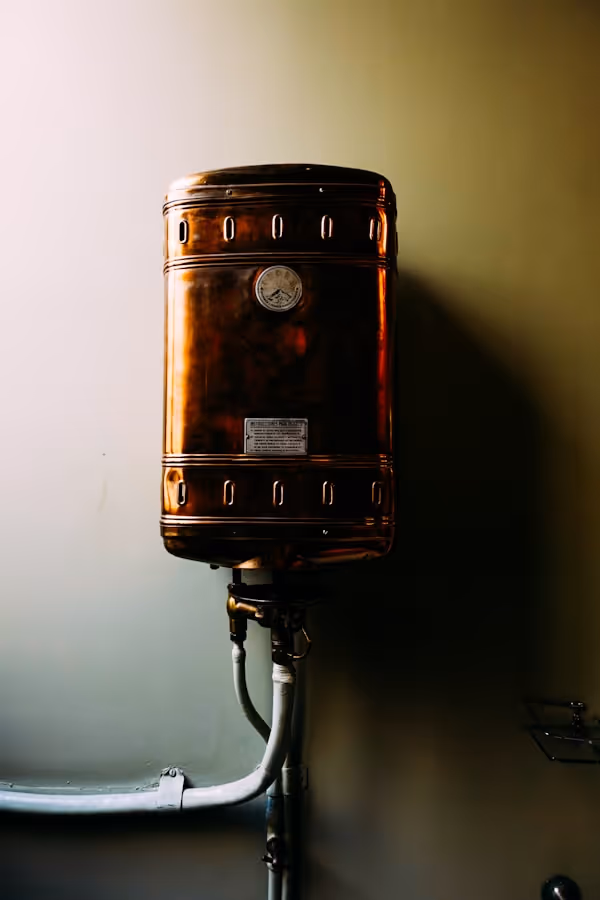 a brown suitcase sitting on top of a metal pole
