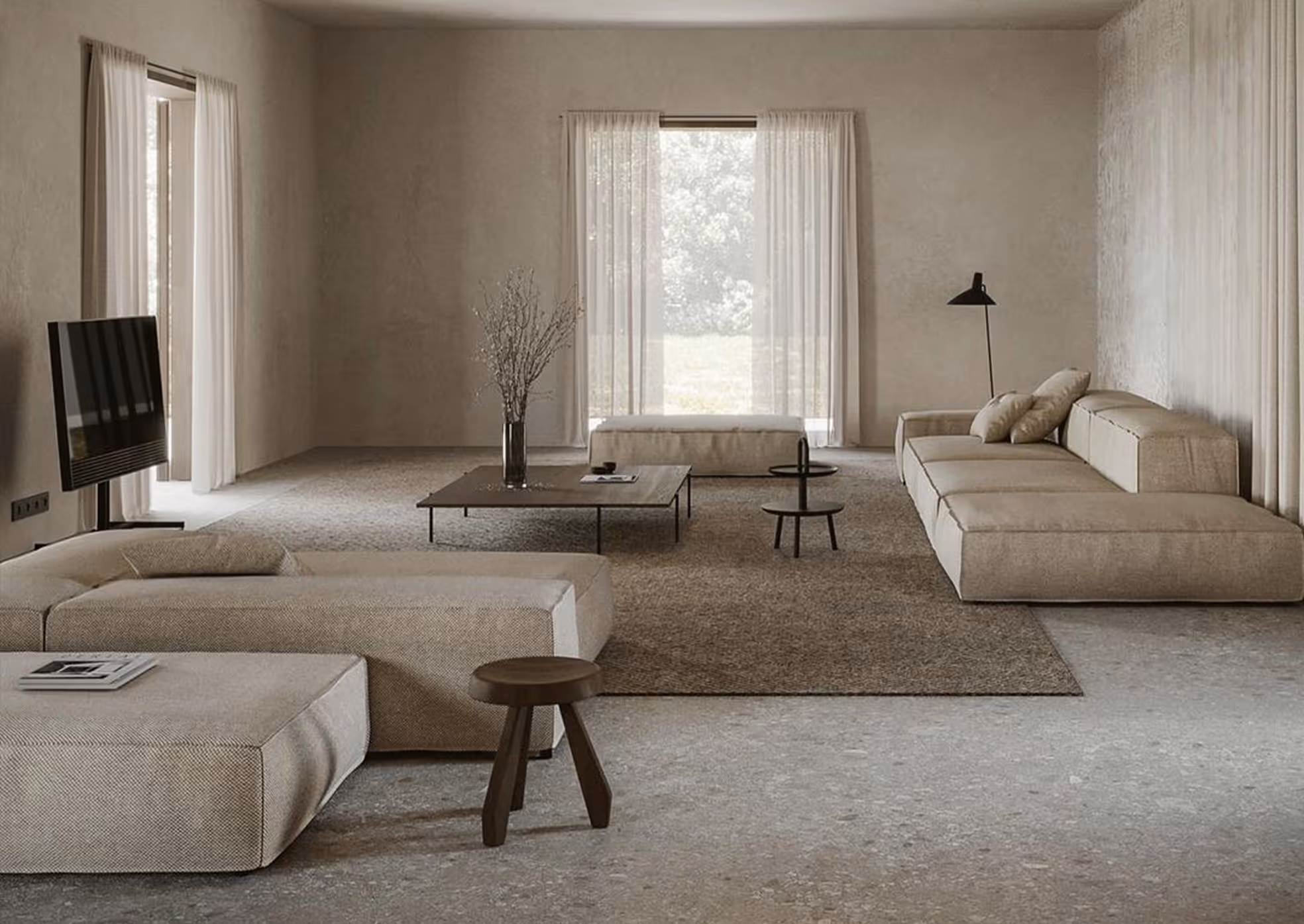 Minimalist living room with beige low sofas, dark coffee tables, floor lamp, and large windows with sheer curtains.