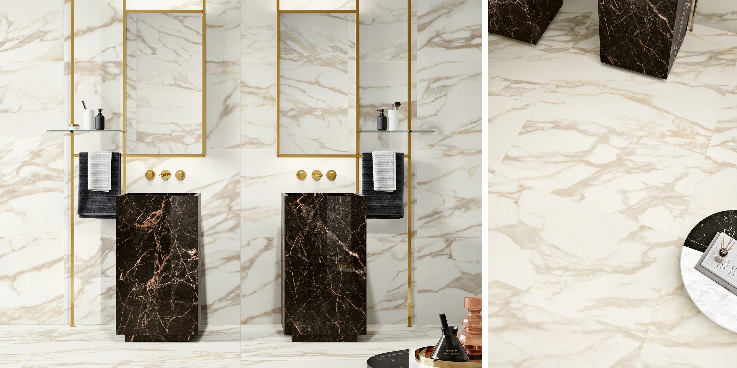 Modern bathroom with white marble walls and floor, black marble pedestal sinks, and gold fixtures.