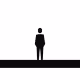 Silhouette of a person standing alone on a flat surface against a white background.