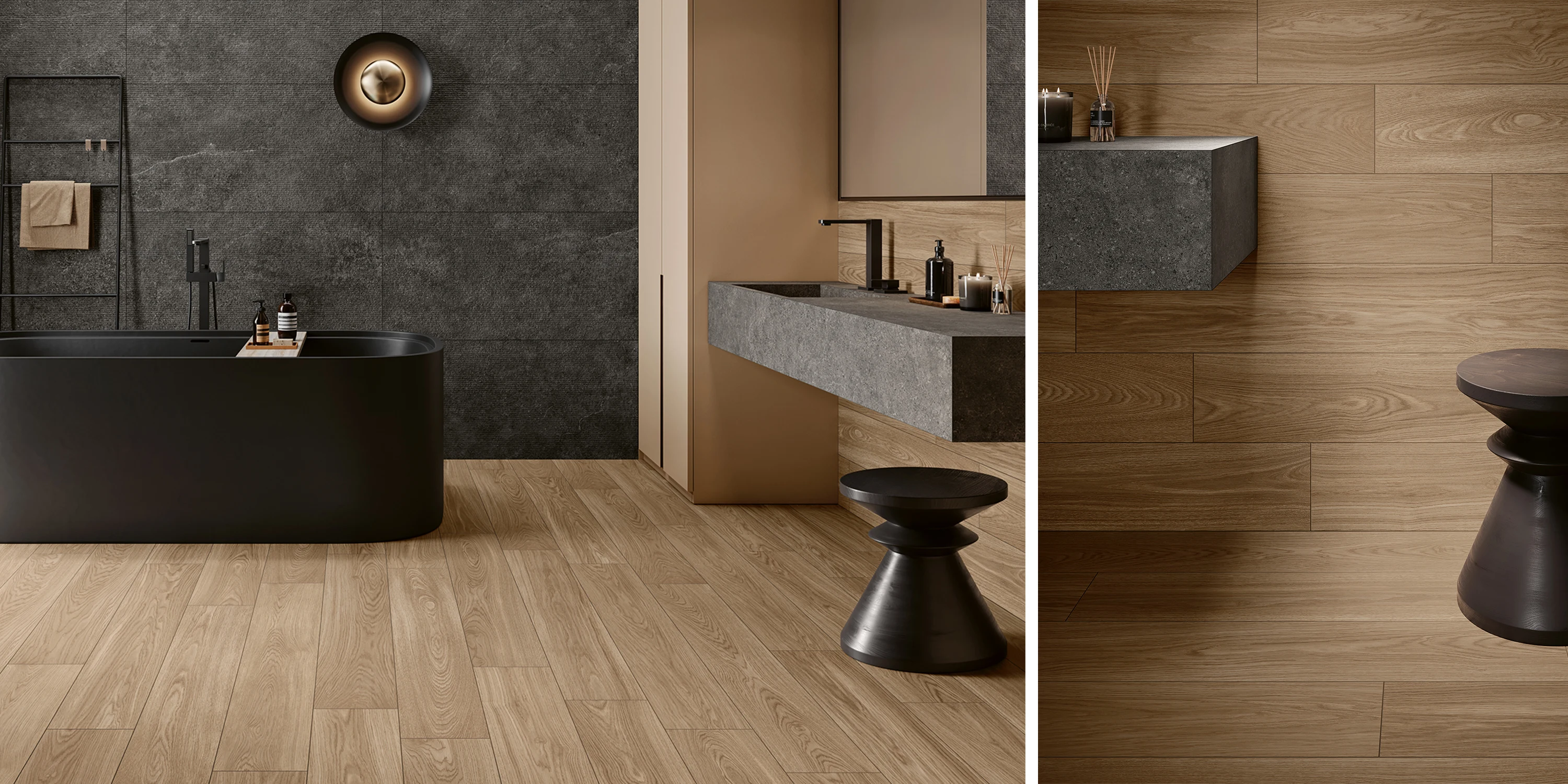 Modern bathroom with black bathtub, dark gray wall, wood floor, floating stone sink, and black stool.
