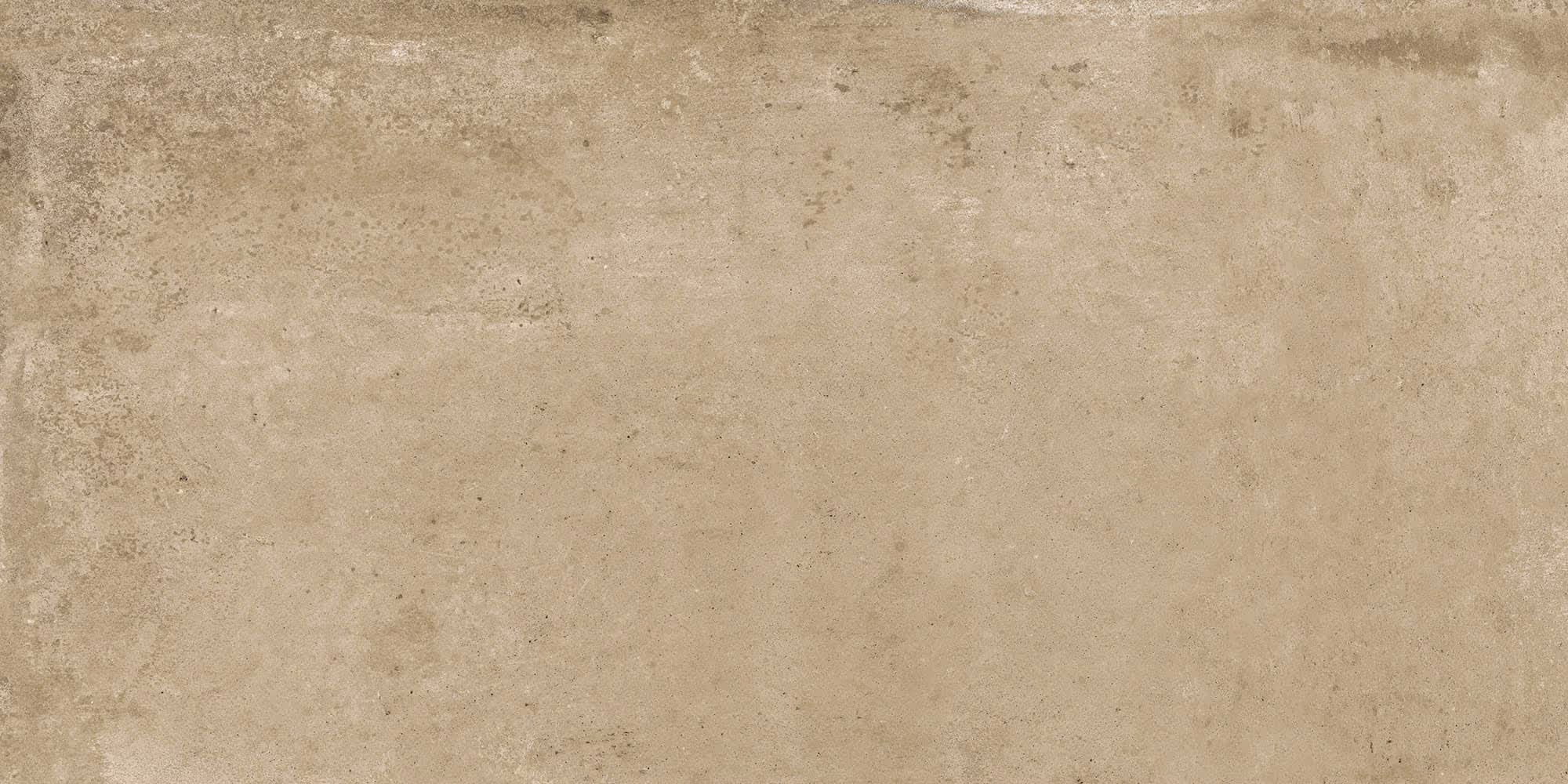 Beige textured surface resembling concrete or stone with subtle variations and specks.