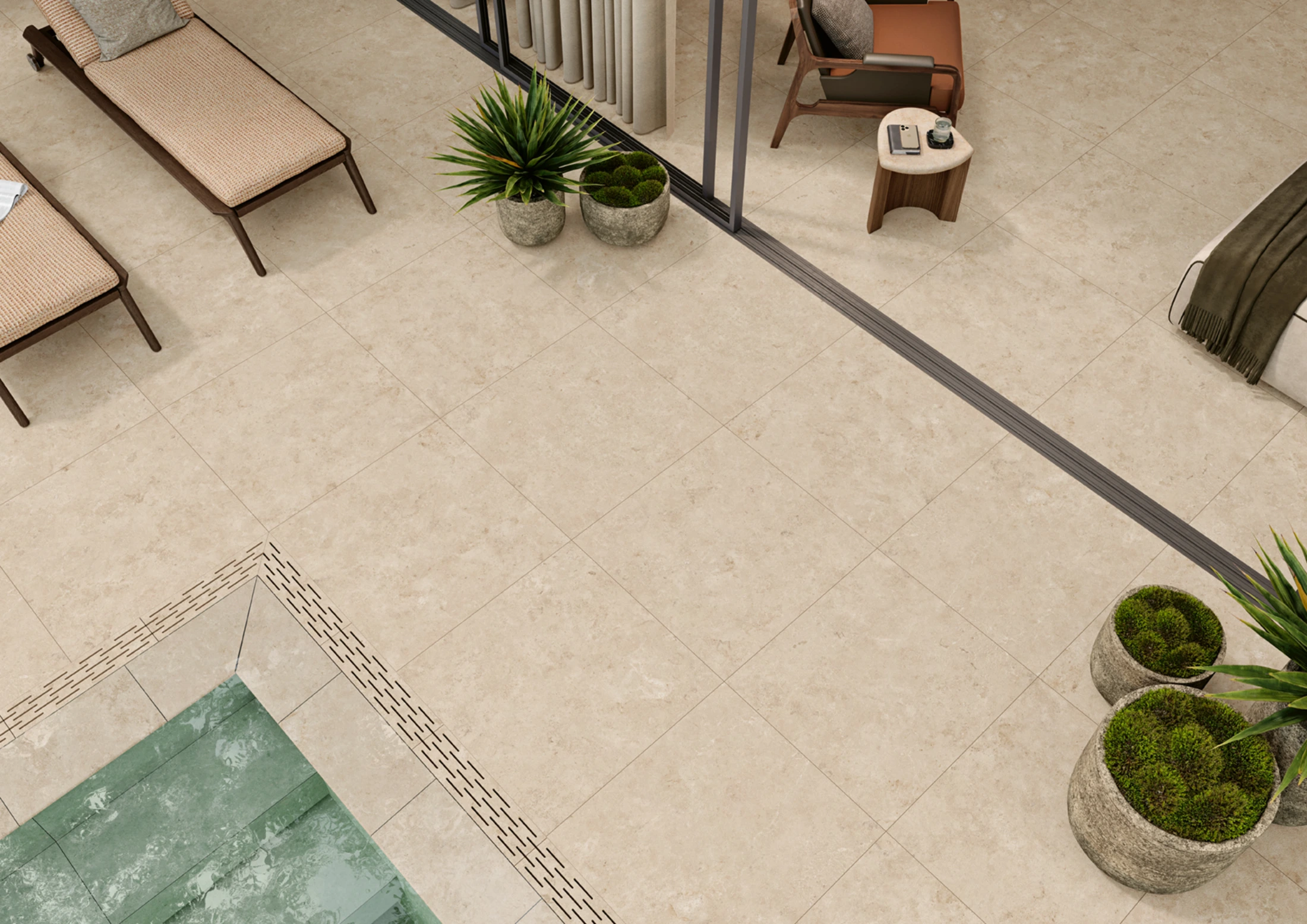 Outdoor patio with beige tiles, plants in stone pots, lounge chairs, and a pool corner.