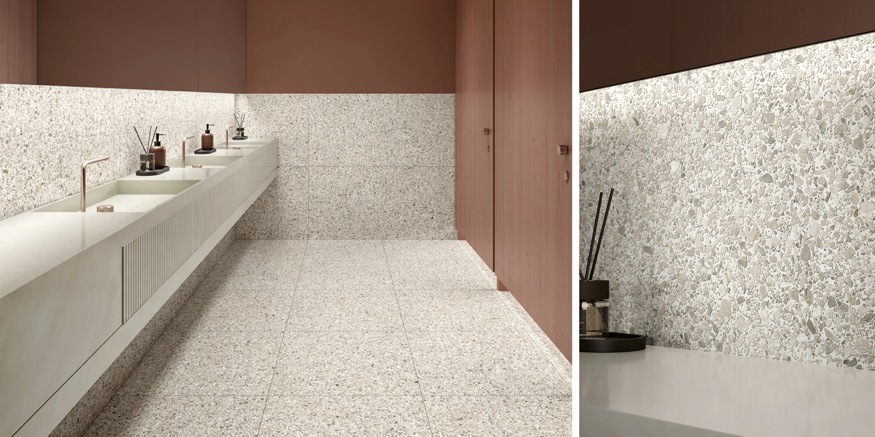 Modern public restroom with beige terrazzo tile floors, walls, and sink backsplash under warm lighting.