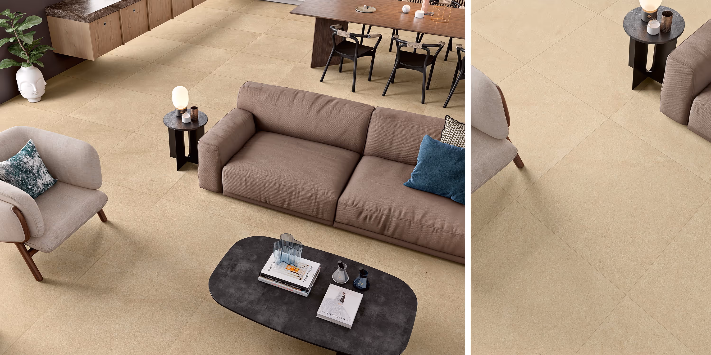 Modern living room with beige tile floor, brown sofa, armchair, black coffee and side tables, and dining area.