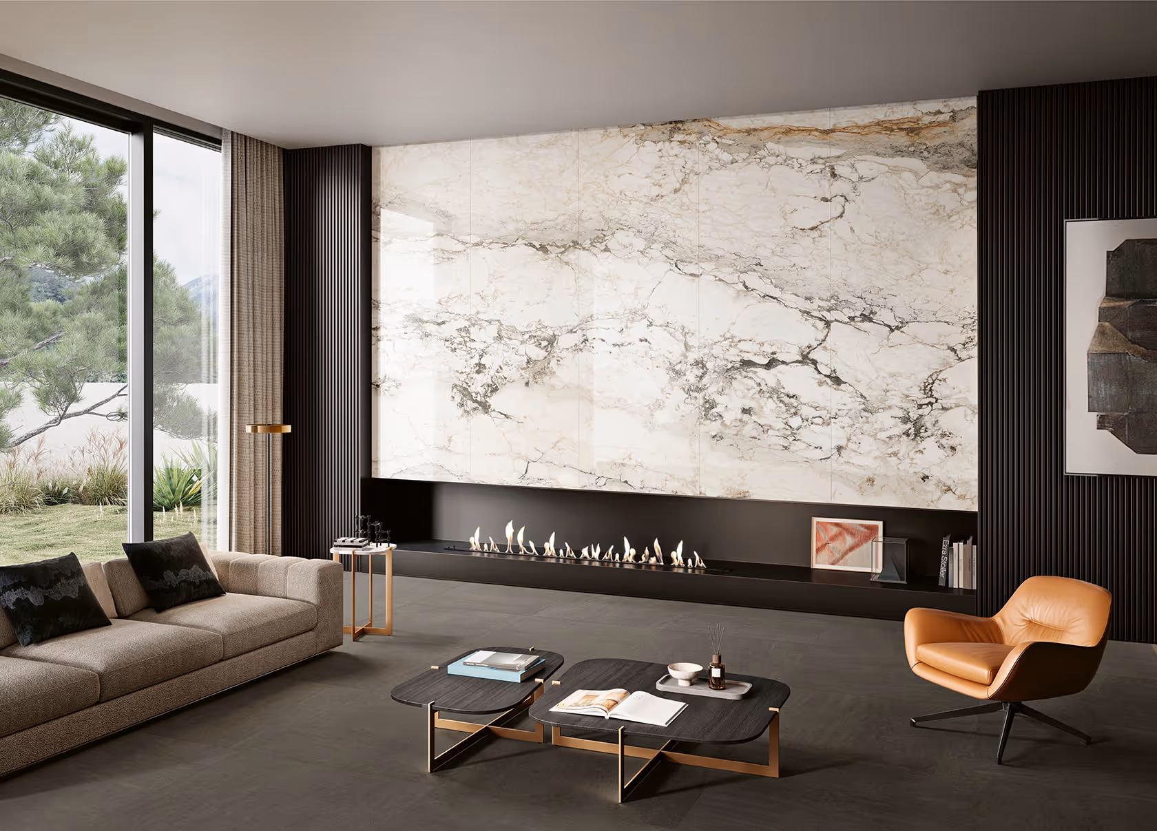 Modern living room with beige sofa, orange armchair, black coffee tables, and linear fireplace below marble wall.