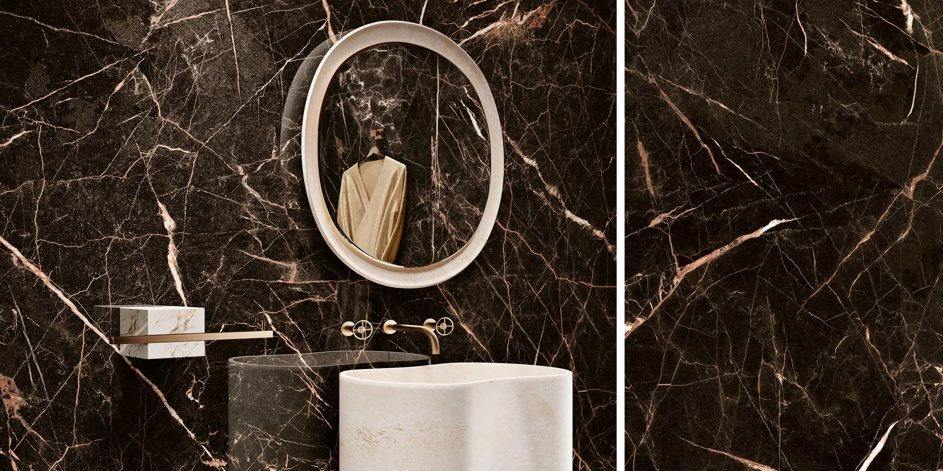 Modern bathroom with dark marble walls, oval mirror, white vessel sink, and gold faucet fixtures.