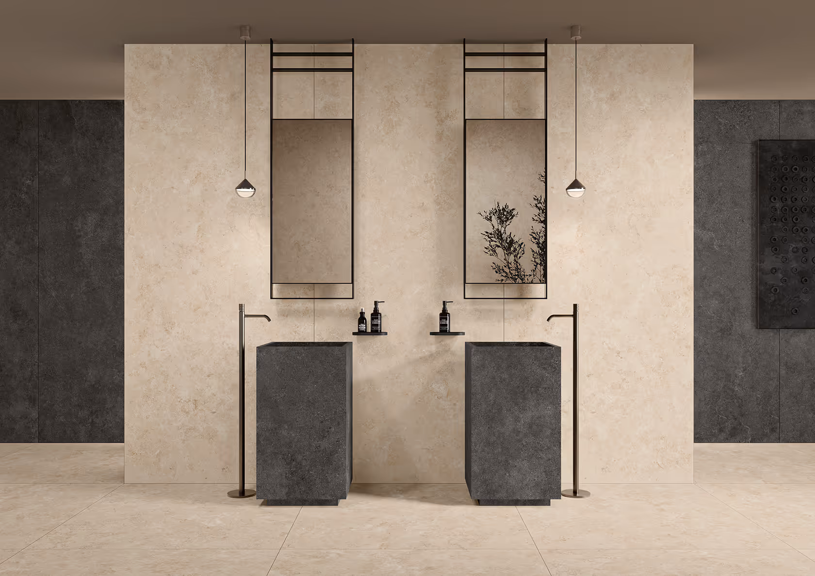 Modern bathroom with two dark stone pedestal sinks, tall faucets, hanging mirrors, and pendant lights.