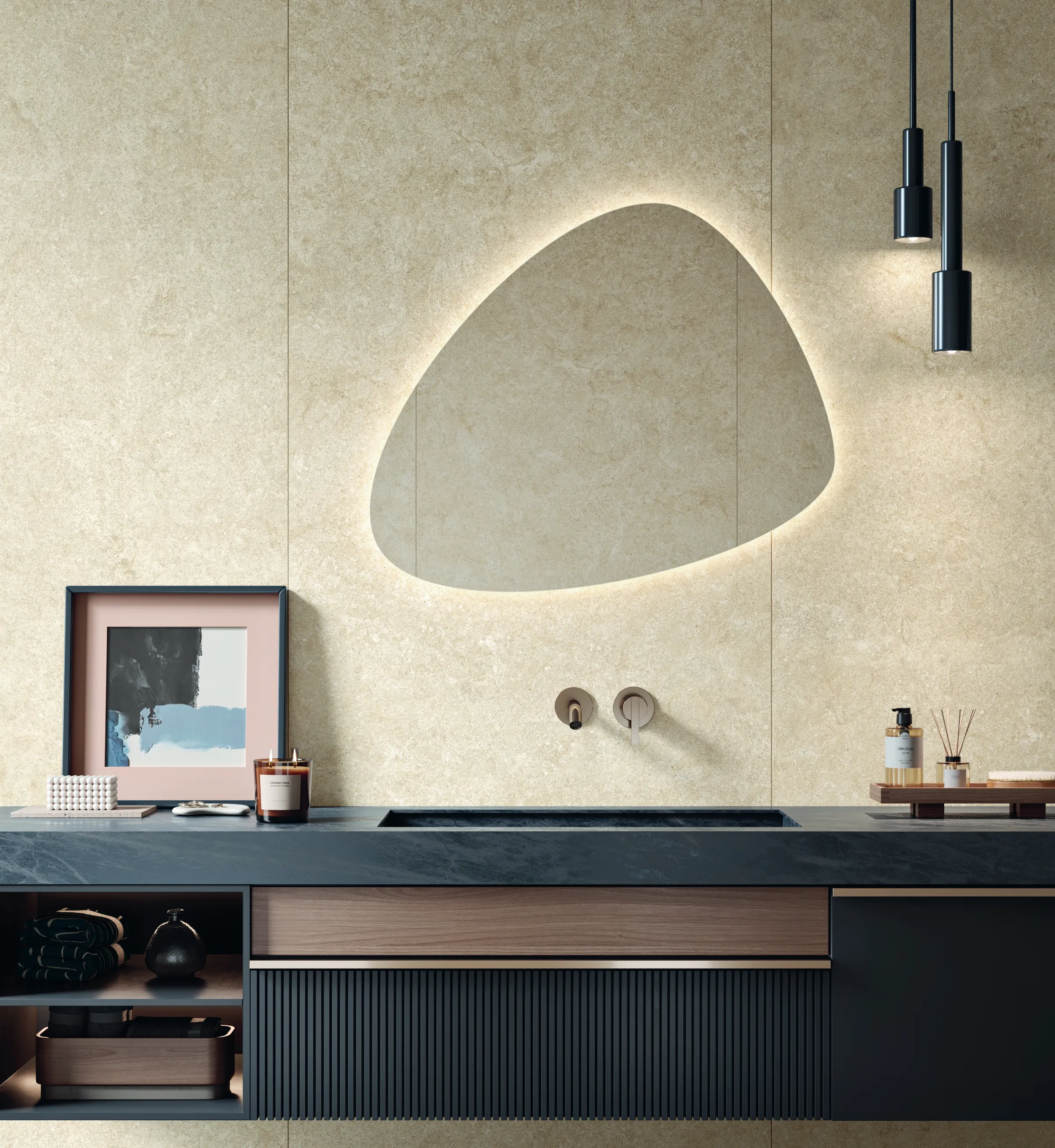 Modern bathroom sink with a black countertop, unique shaped backlit mirror, and hanging pendant lights.