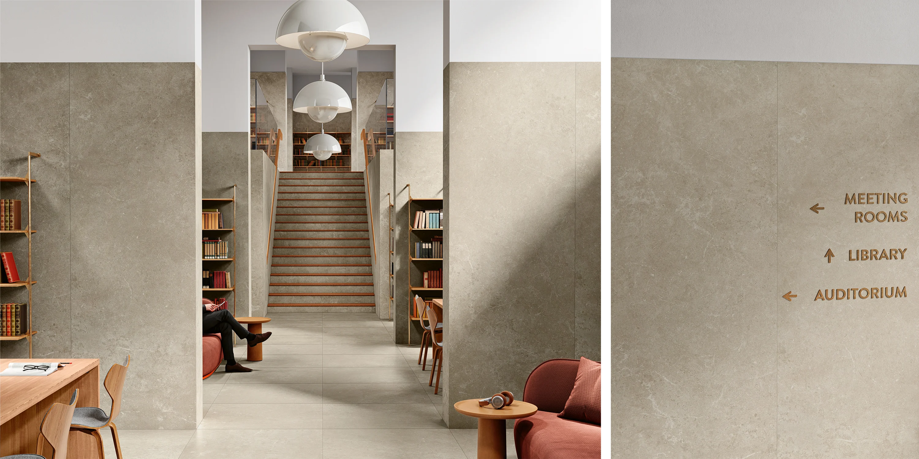 Modern library interior with a staircase, bookshelves, seating areas, and wall signs for rooms.