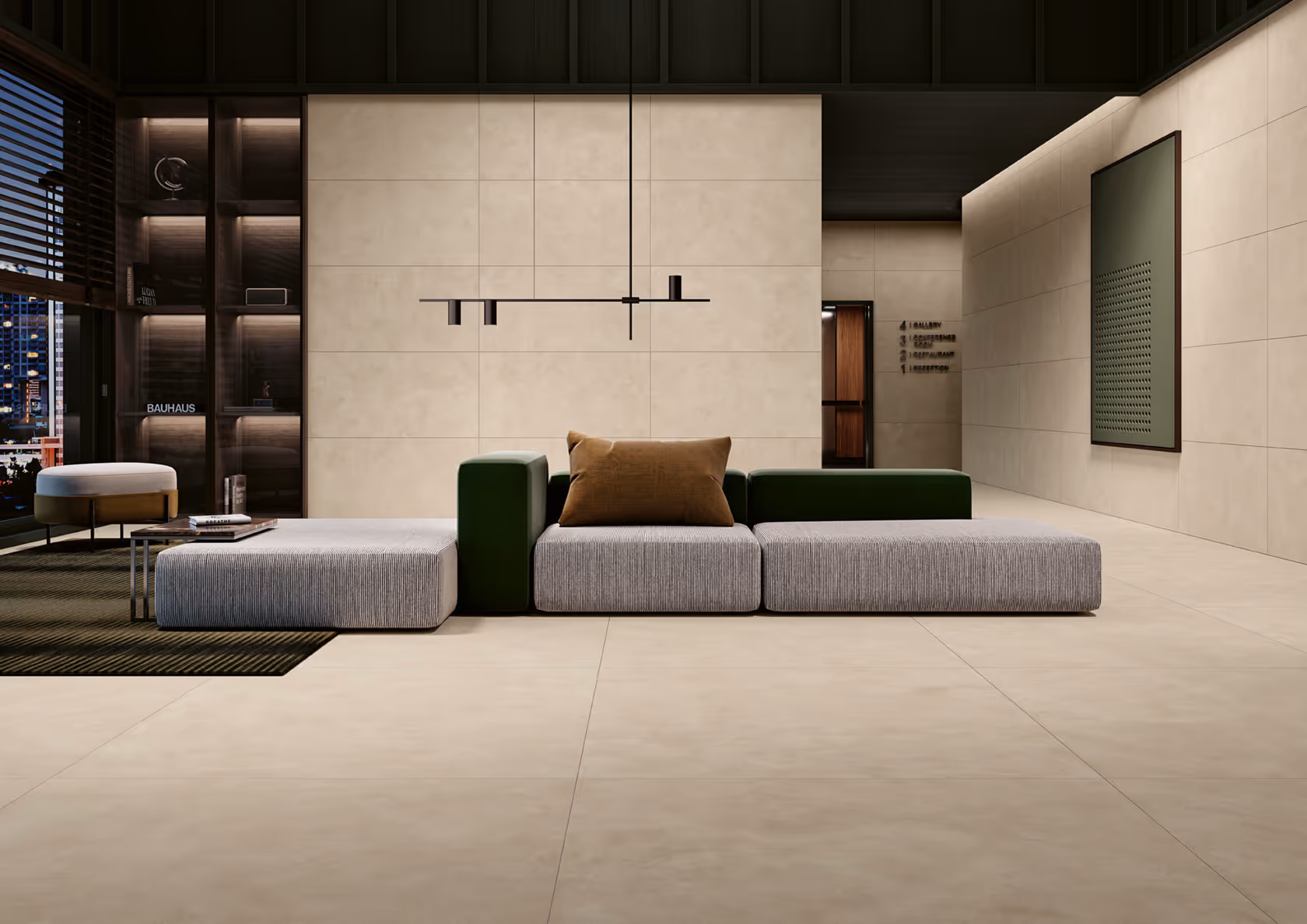 Modern living room with modular gray and green sofa, beige tiled walls, and urban night view window.