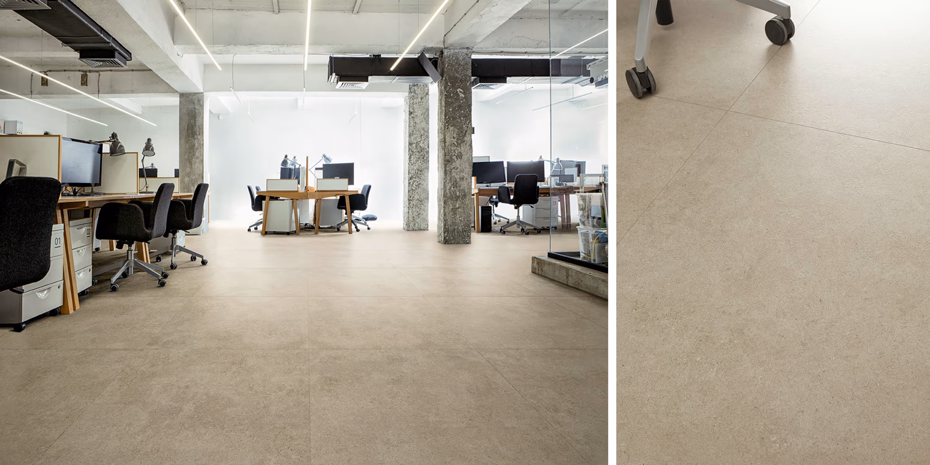 Modern office with beige stone tile flooring, workstations, chairs, and large concrete columns.