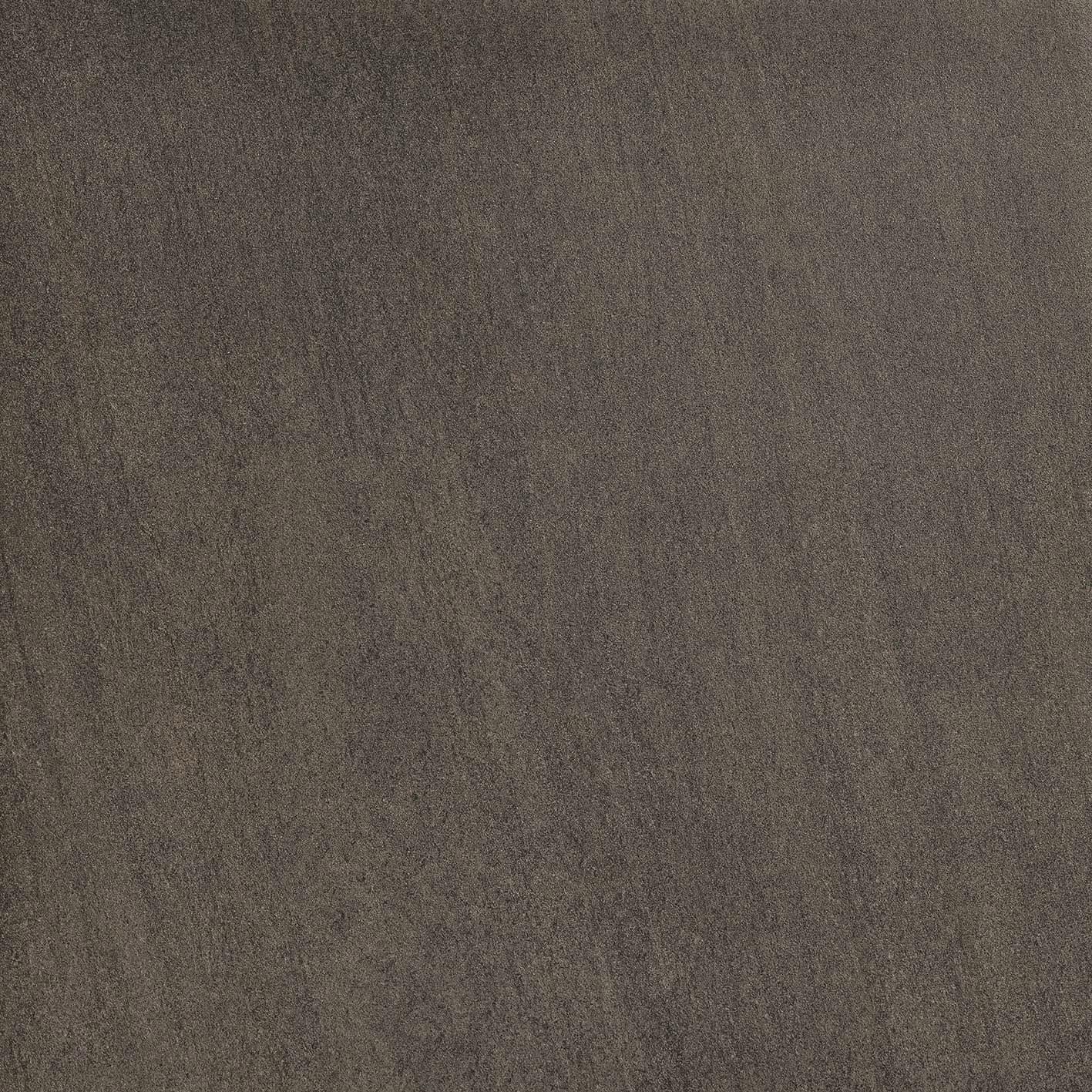 Close-up of a textured gray surface with fine granular and subtle linear patterns.
