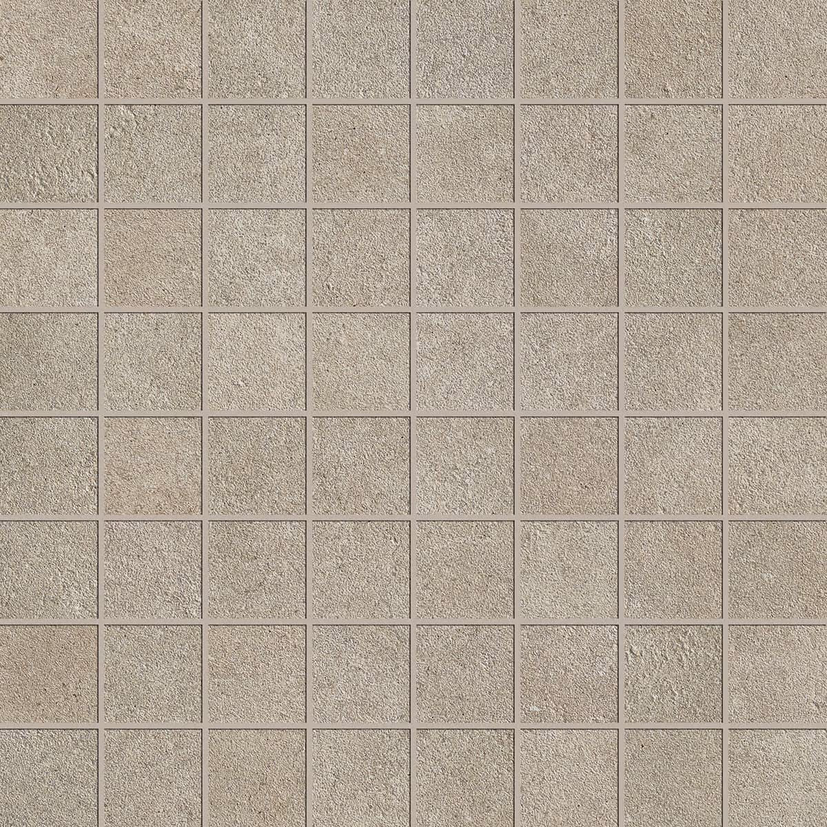 Grid of square, rough-textured beige stone tiles arranged evenly in rows and columns.