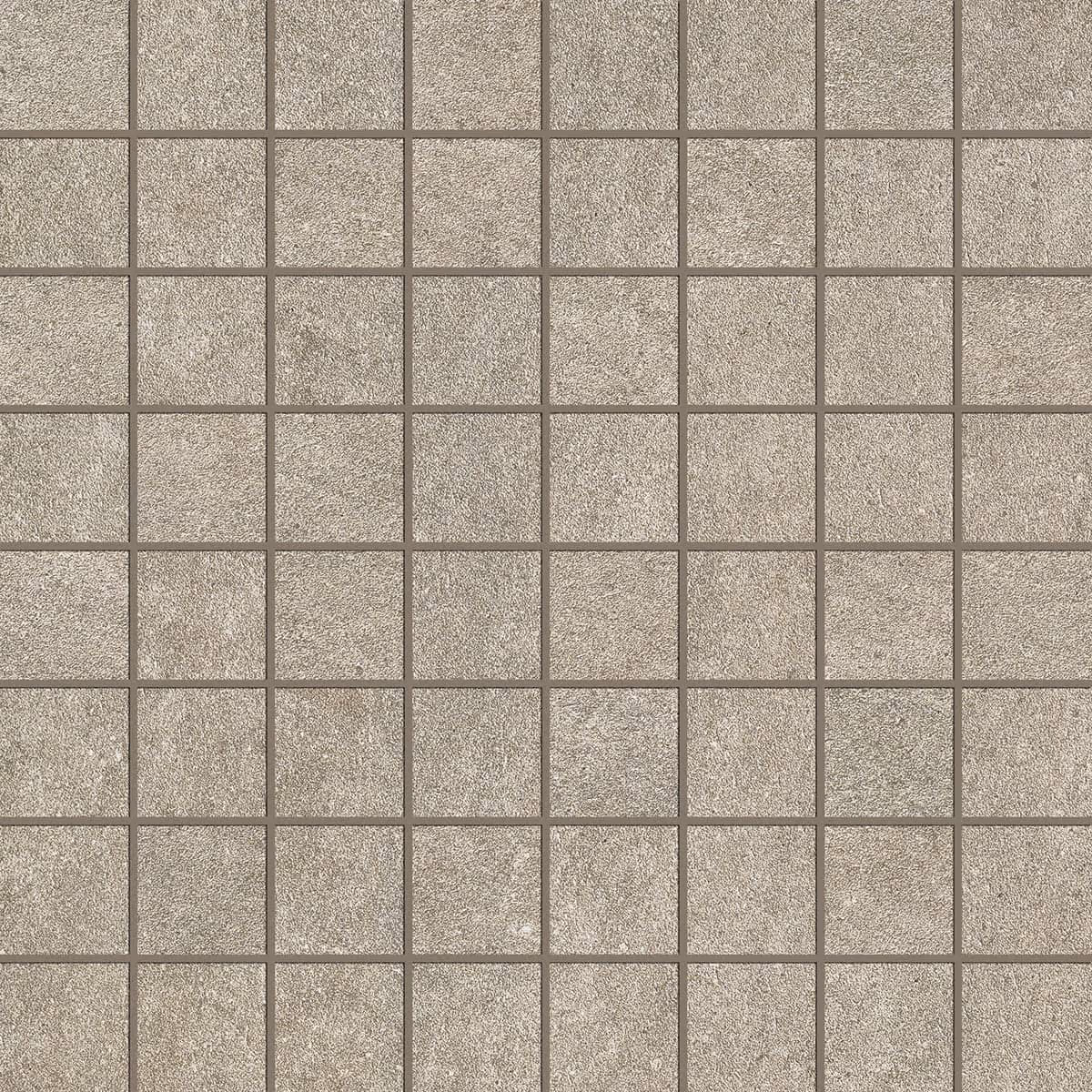 Square beige stone tiles with a textured surface and grout lines in a grid pattern.
