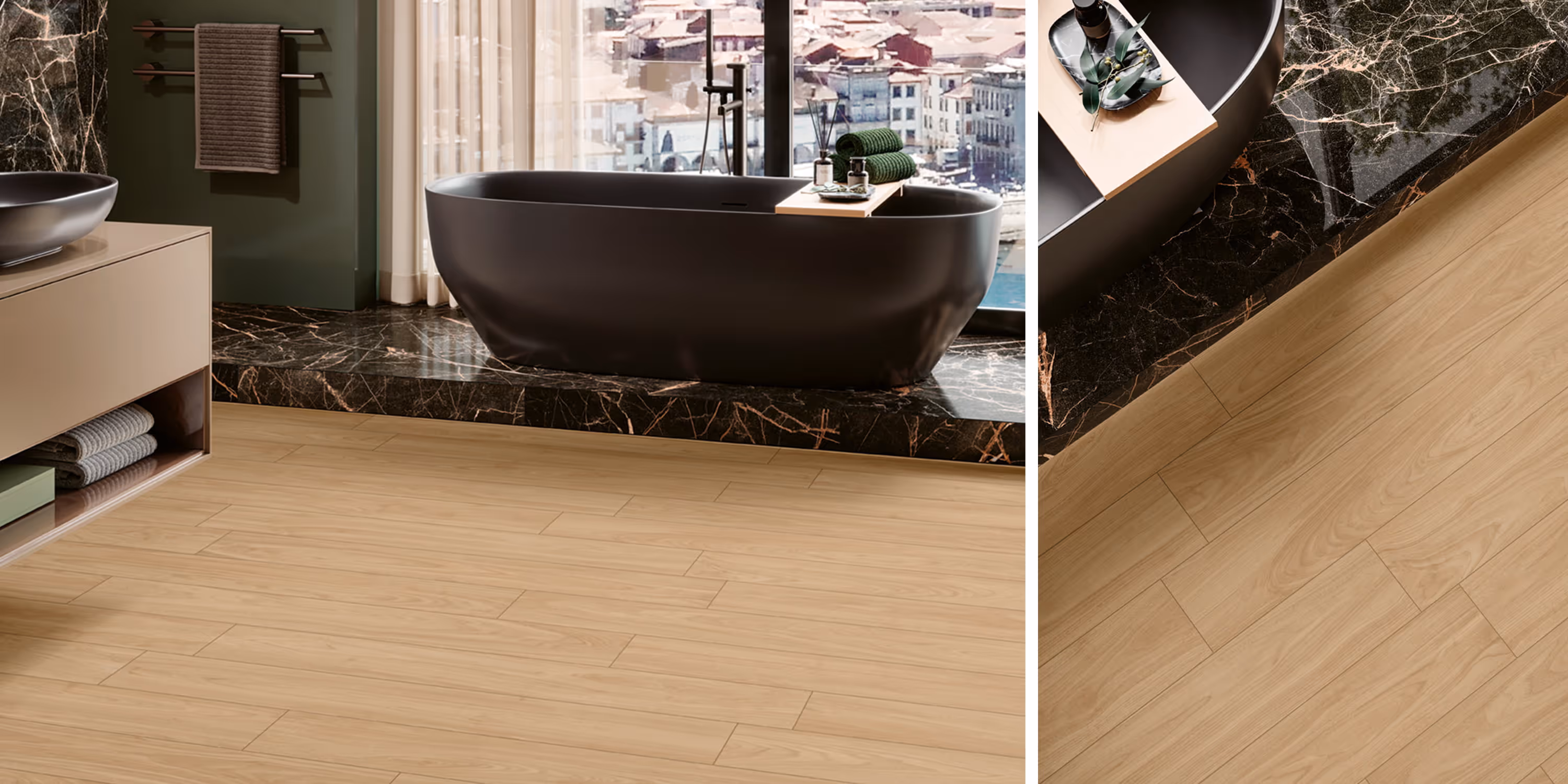 Modern bathroom with black freestanding tub on marble platform and light wood plank flooring.