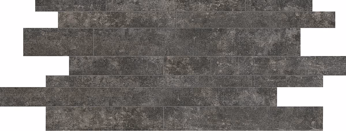 Dark gray textured bricks arranged in staggered horizontal rows with irregular gaps.