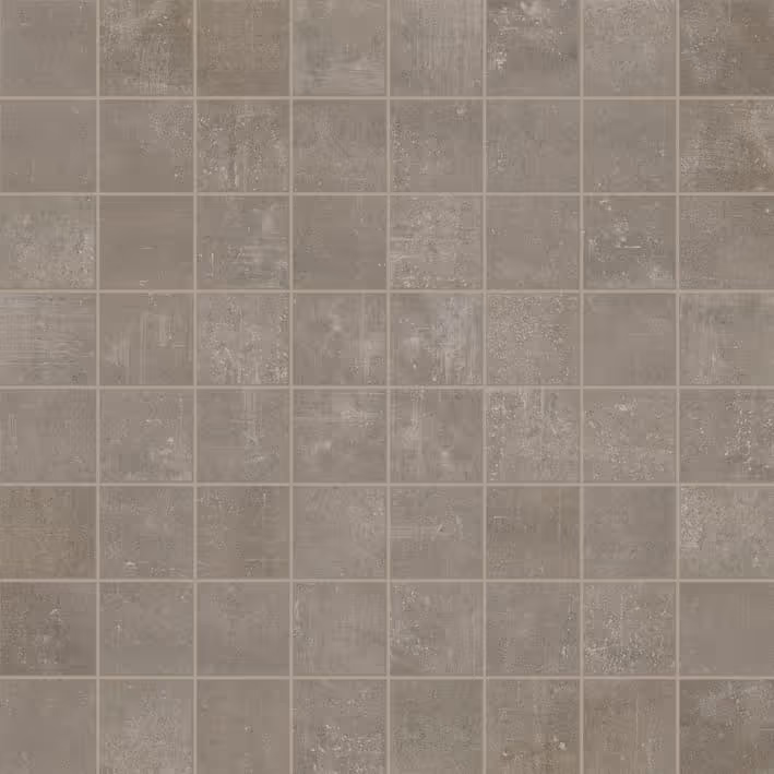 Grid of gray mosaic tiles with varied subtle textures and tones.