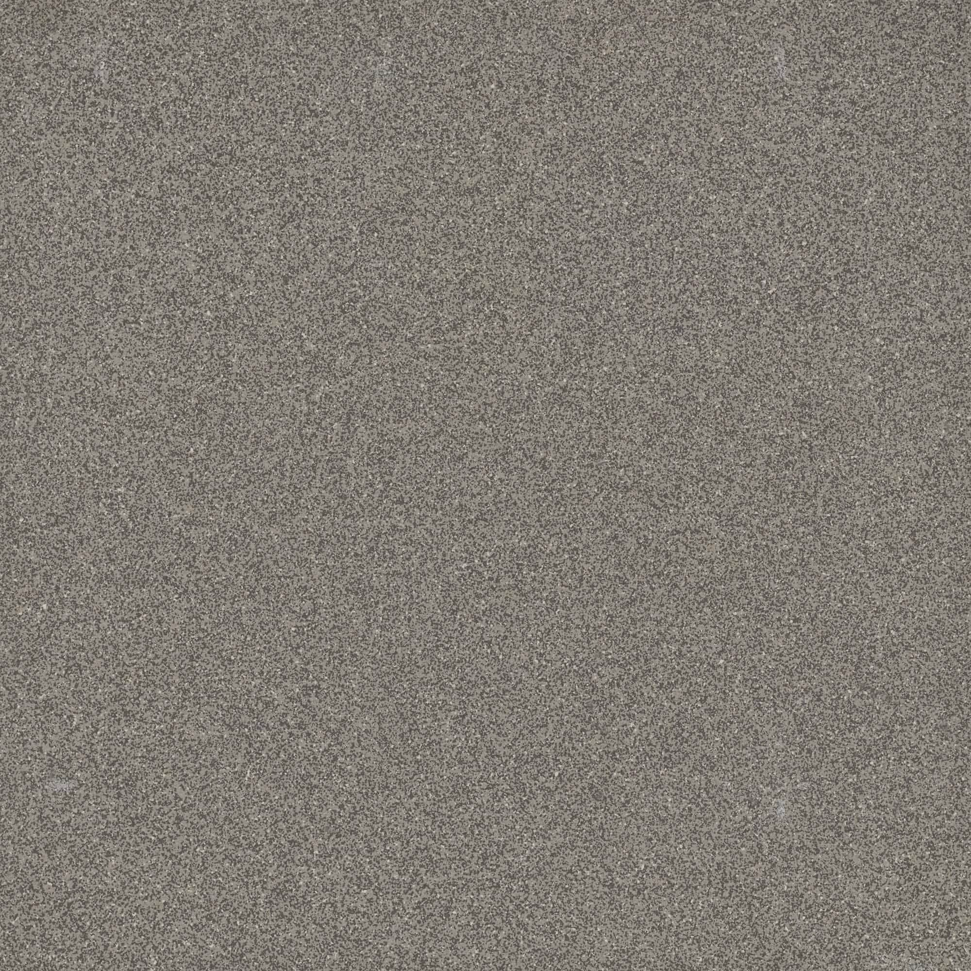 Close-up of gray granite stone texture with small speckled mineral patterns.