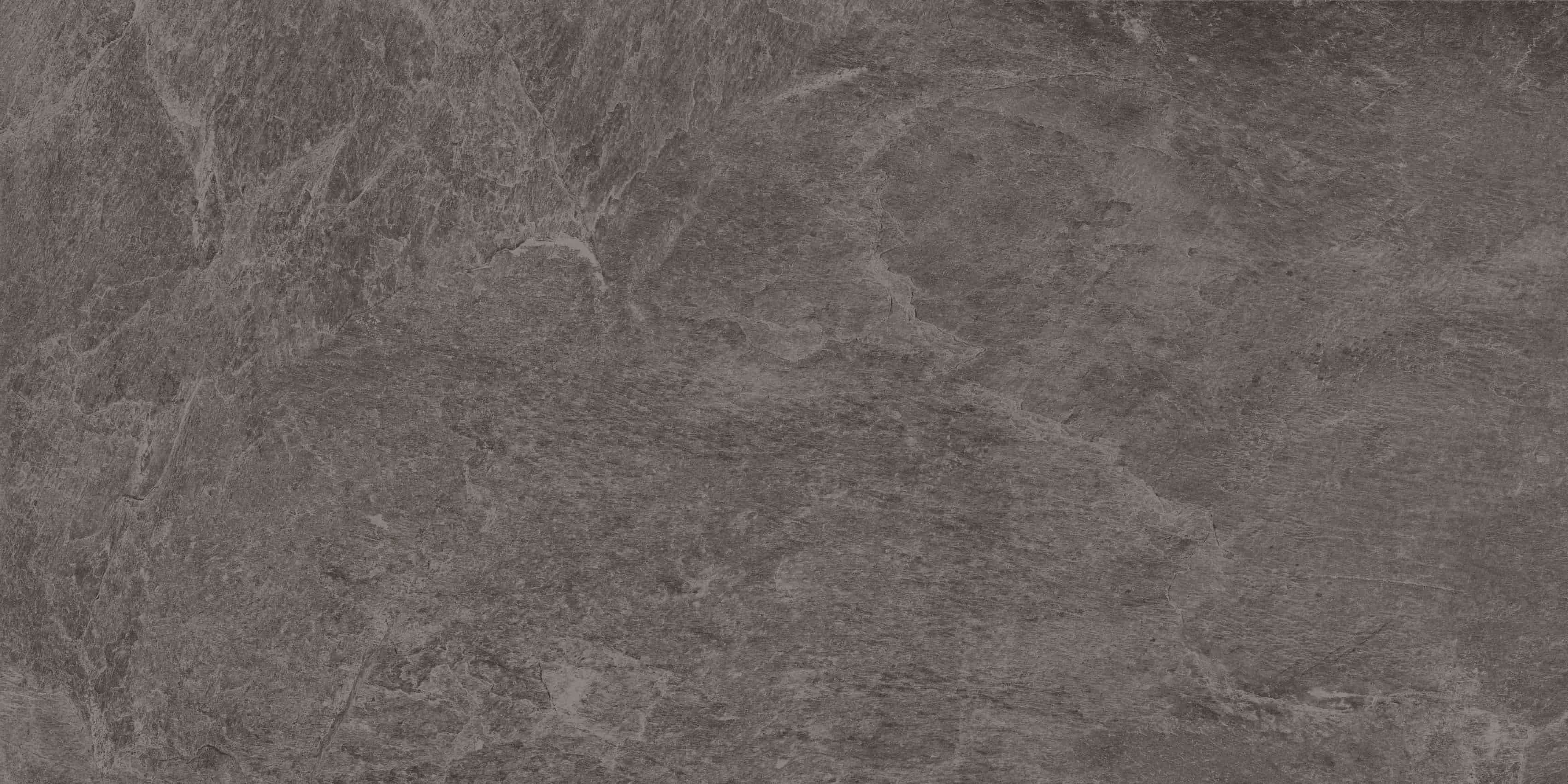 Dark gray textured stone surface with natural patterns and subtle color variations.