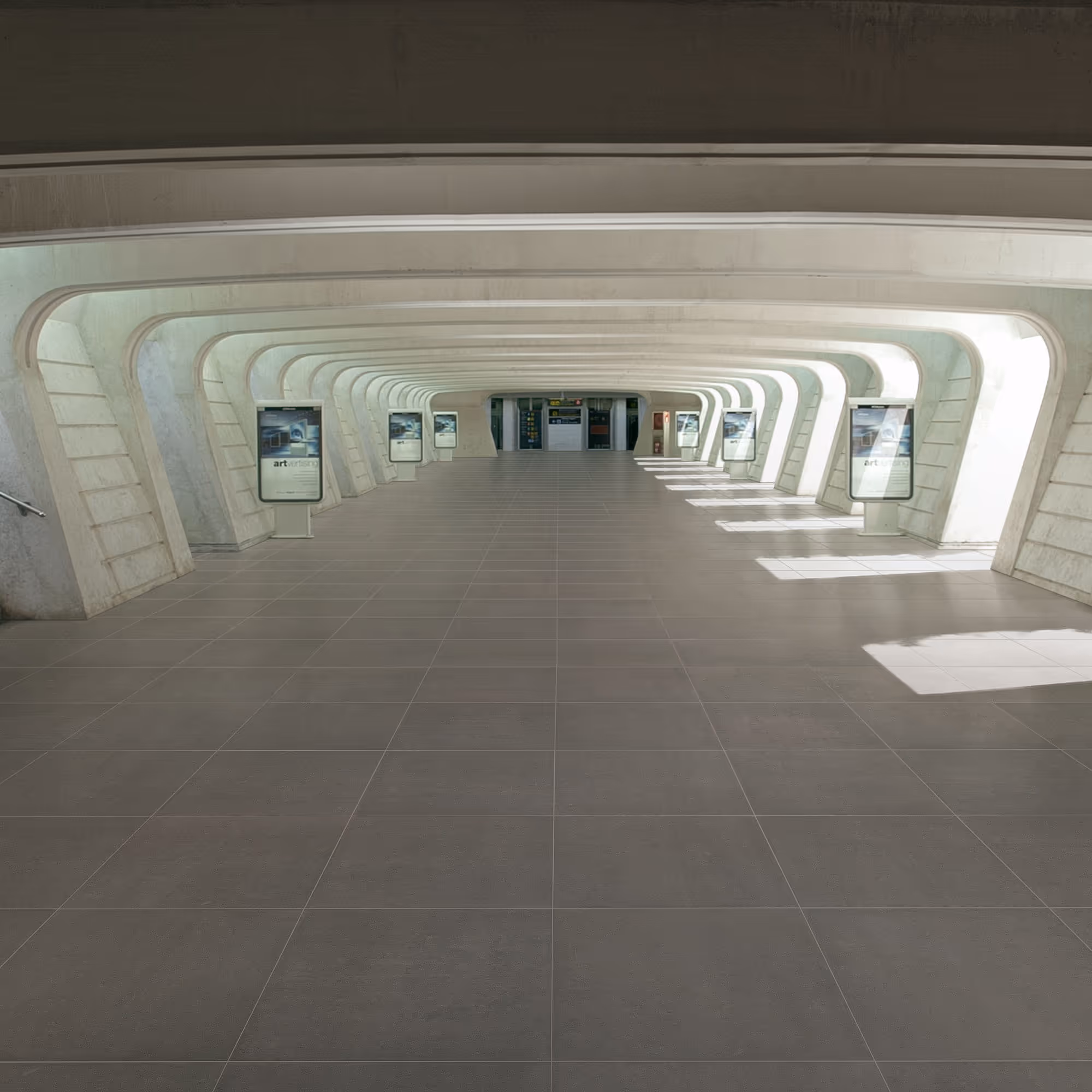 Empty modern corridor with white curved supports and floor advertising displays on each side.