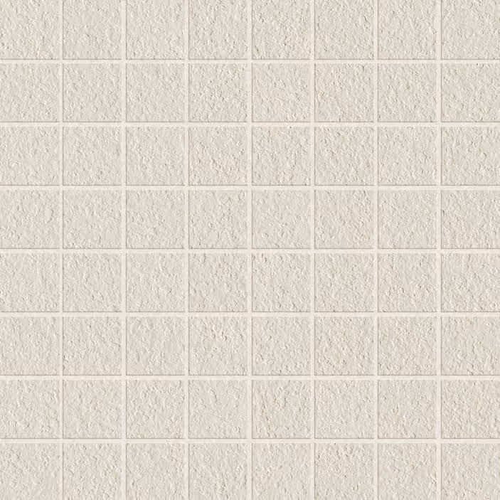 Square mosaic tiles with a textured, rough surface in a light, off-white color.