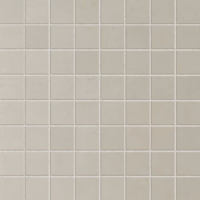Grid of light gray square tiles with grout lines forming a uniform mosaic pattern.