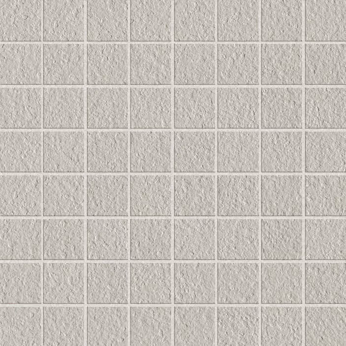 Grid of small square tiles with a rough, stone-like silver texture.