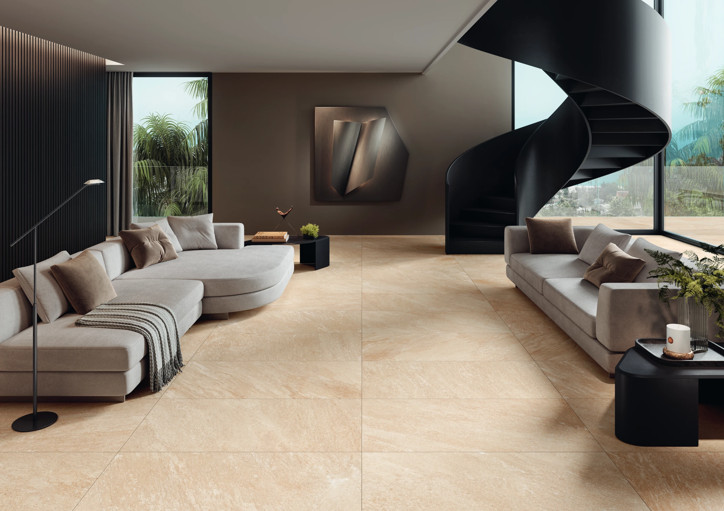 Modern living room with beige sofas, black spiral staircase, large windows, and light stone tile floor.