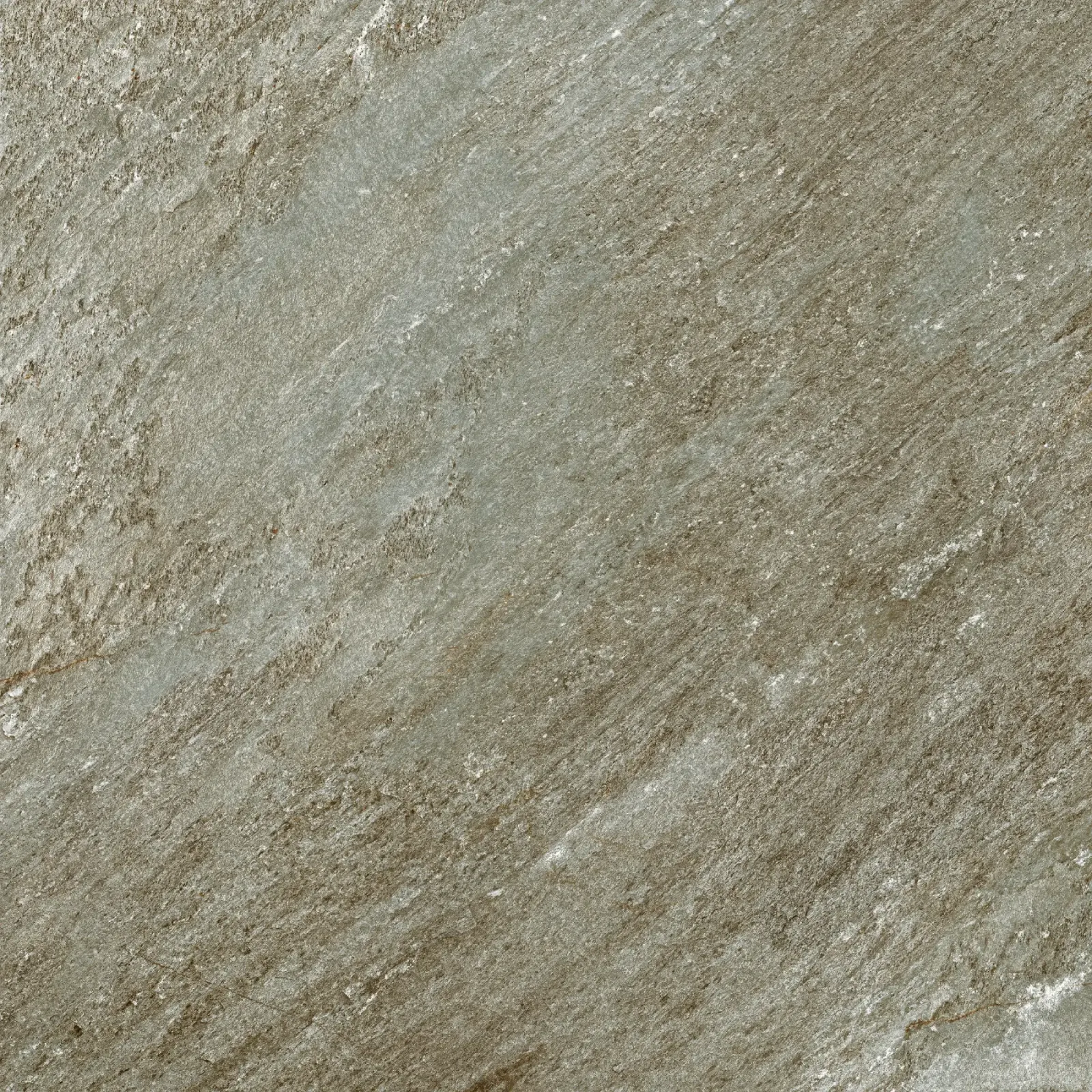 Close-up of textured stone surface with grey and brown streaks and rough patterns.