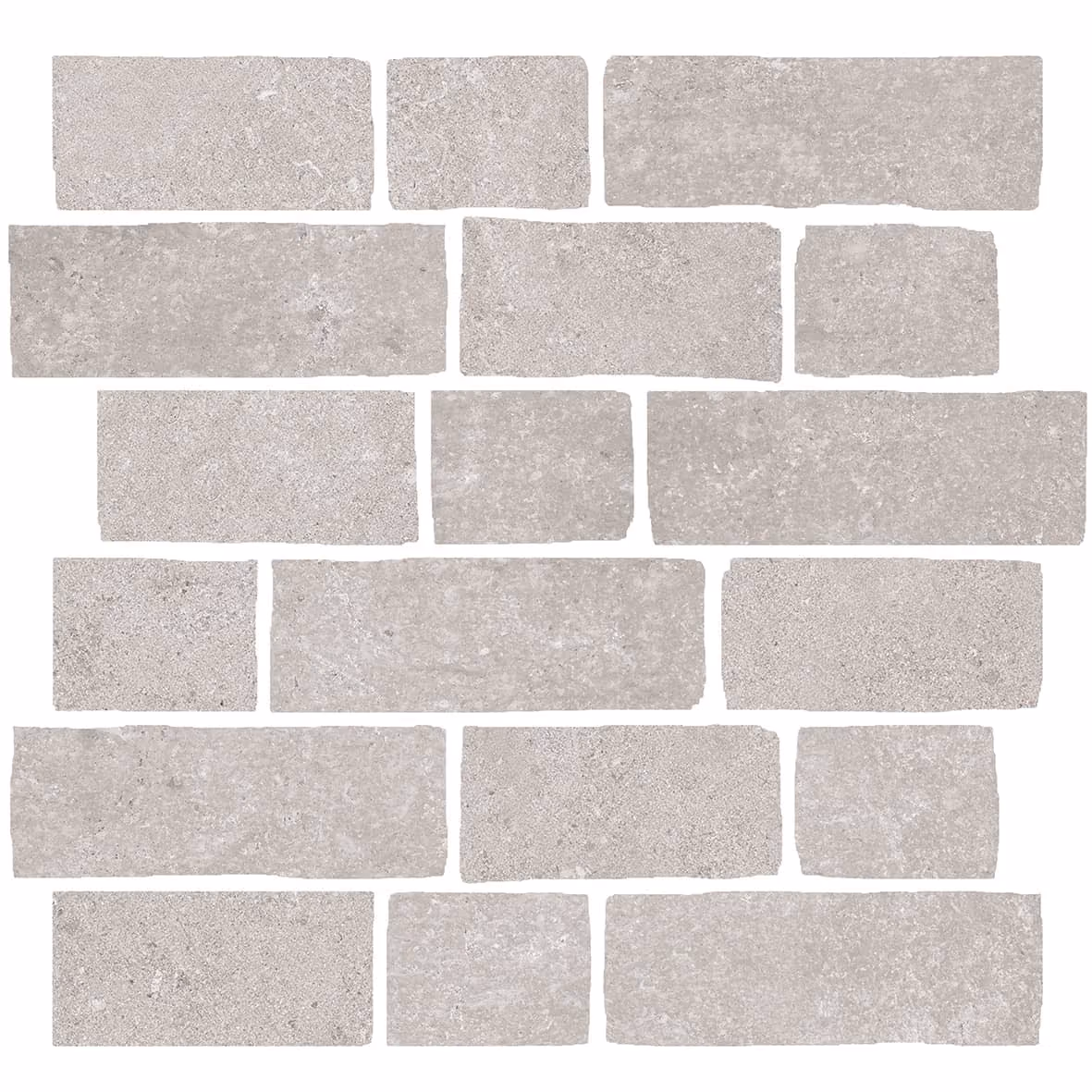 Pattern of rectangular light gray bricks with rough texture on a white background.