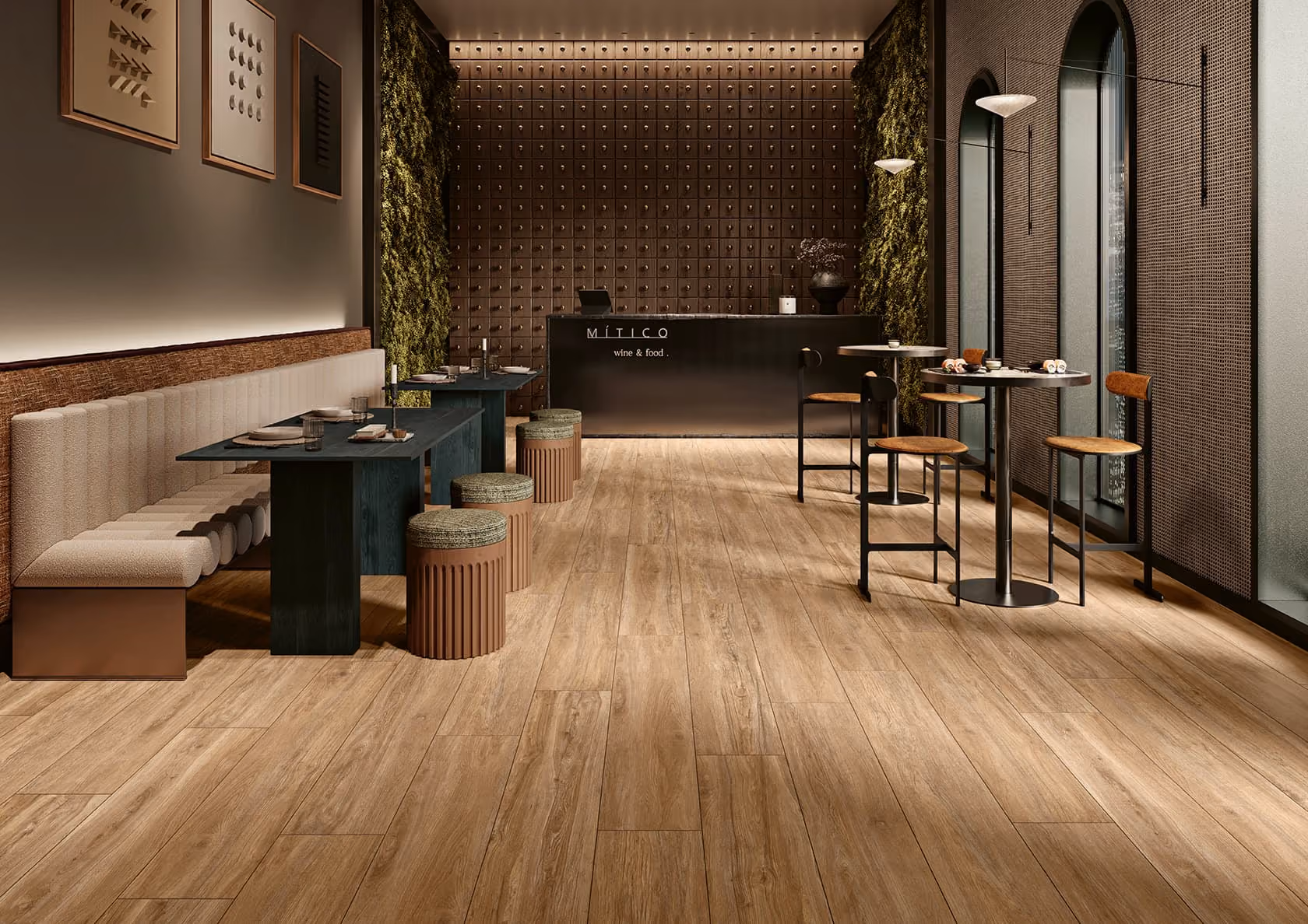 Modern restaurant interior with wooden floor, upholstered seating, green wall panels, and high tables with chairs.