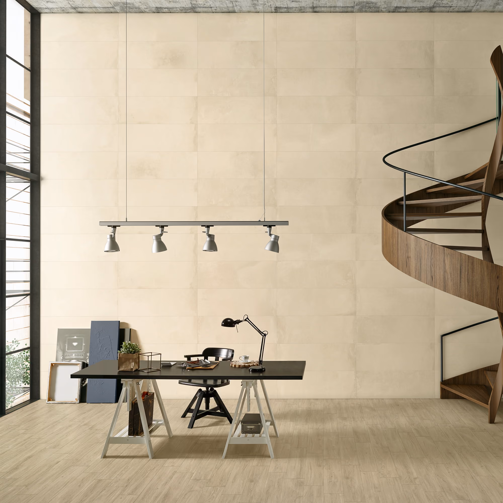 Modern workspace with a black chair, desk lamp, minimalist desk, and wooden spiral staircase.