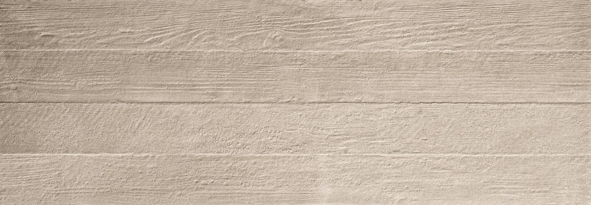 Close-up of light grey concrete surface with horizontal wood grain texture.