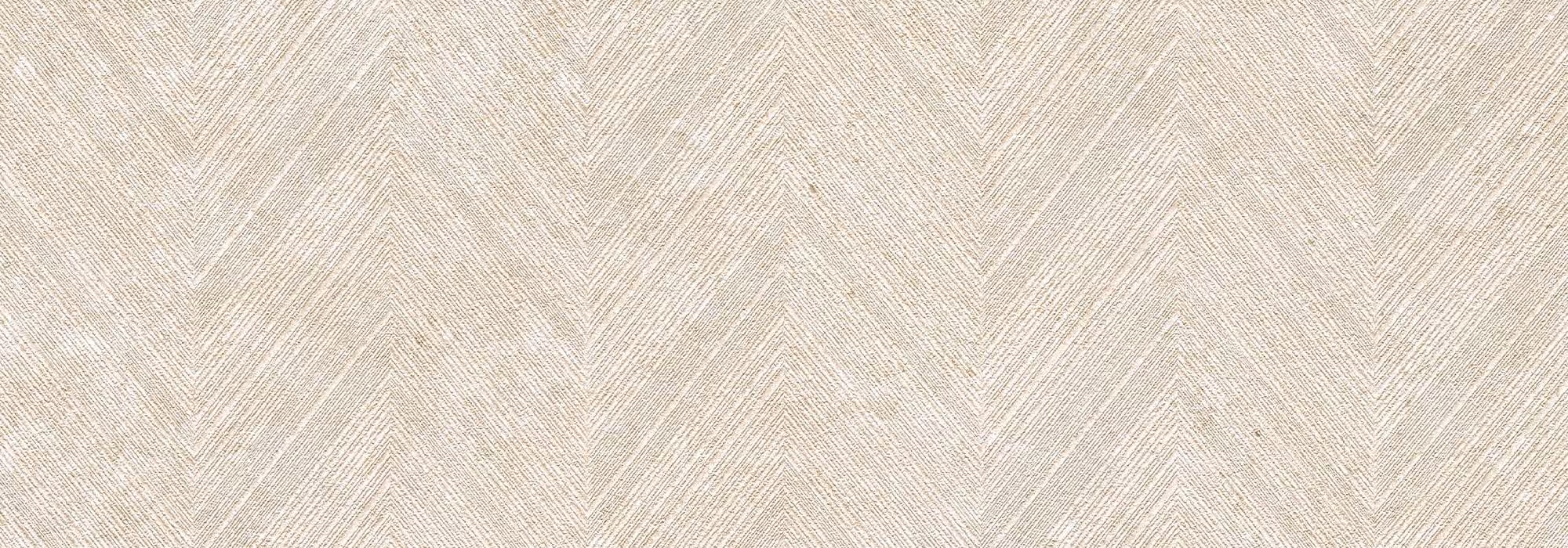 Light beige textured surface with a repeating chevron pattern.