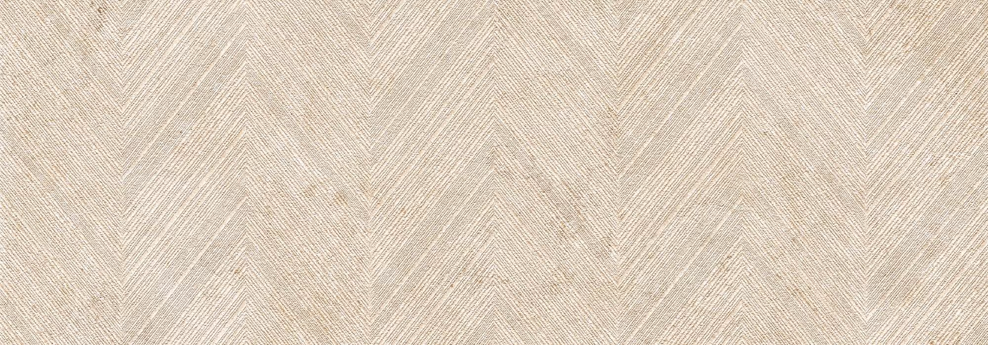 Beige textured fabric with a repeating herringbone chevron pattern.