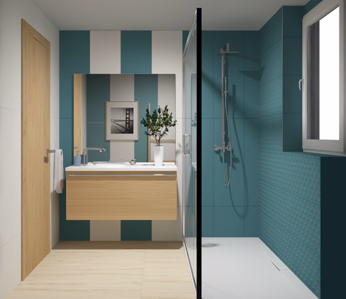 Modern bathroom with teal and white striped wall, wooden vanity, glass shower, and window.
