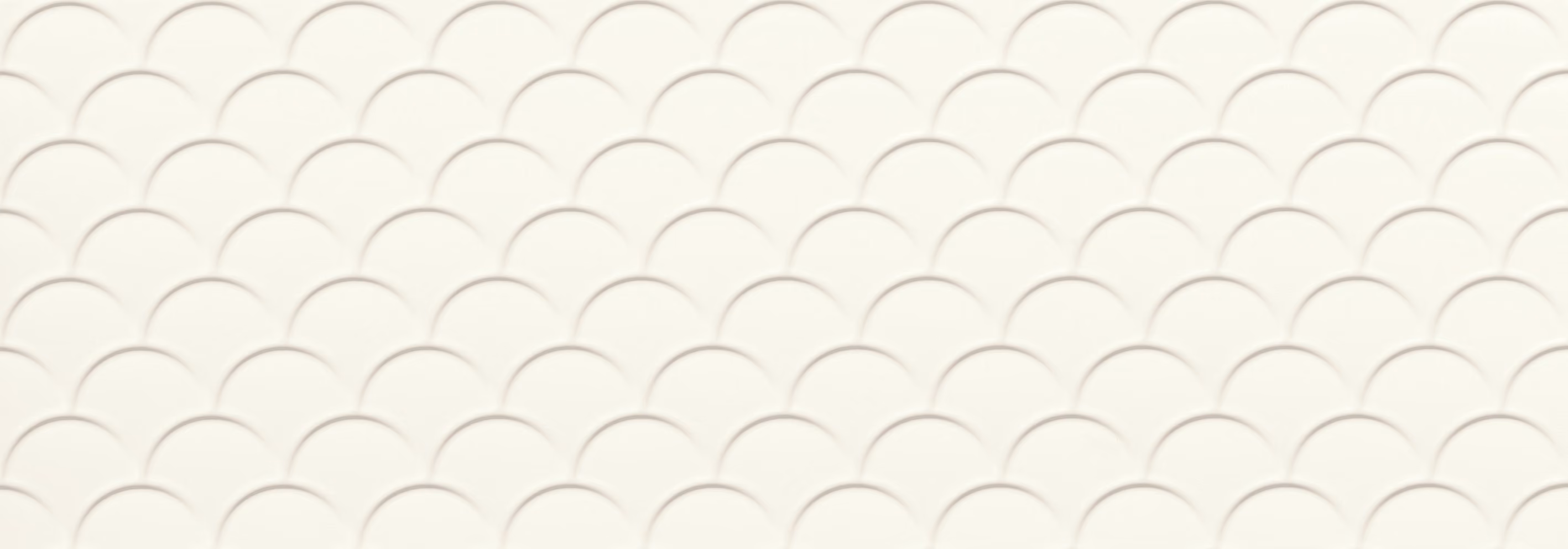 White surface with a repeating pattern of overlapping semicircles creating a scalloped texture.