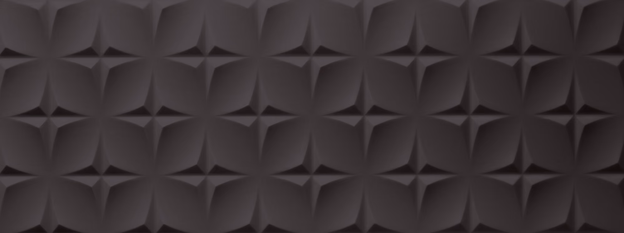 Black textured surface with a repeating geometric pattern of four-pointed star shapes.