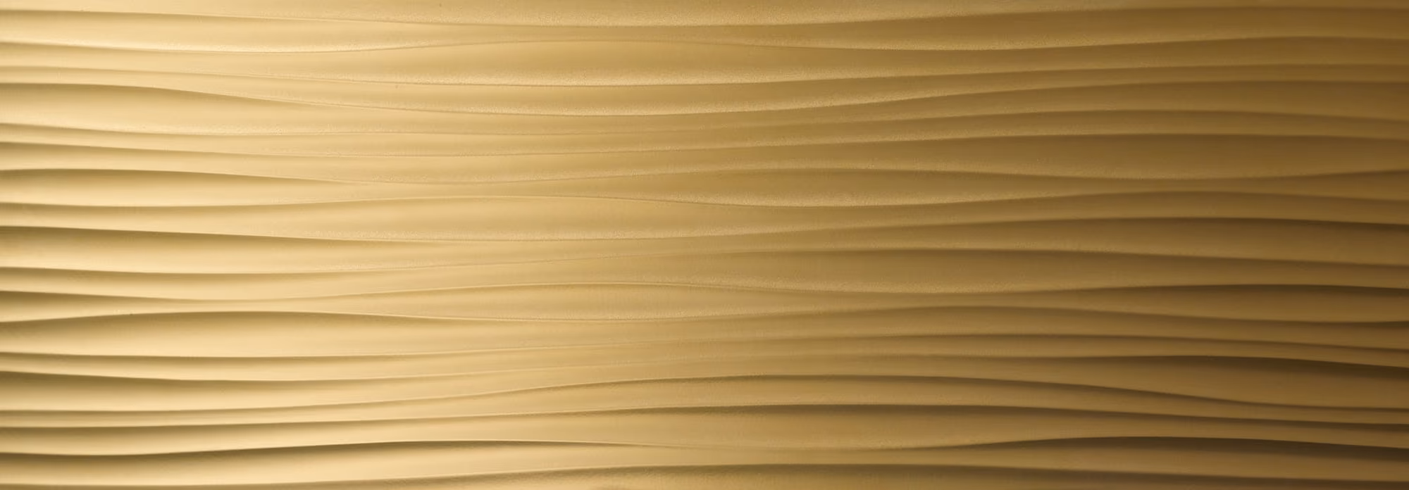 Golden wavy textured surface with smooth horizontal ridges creating a flowing pattern.