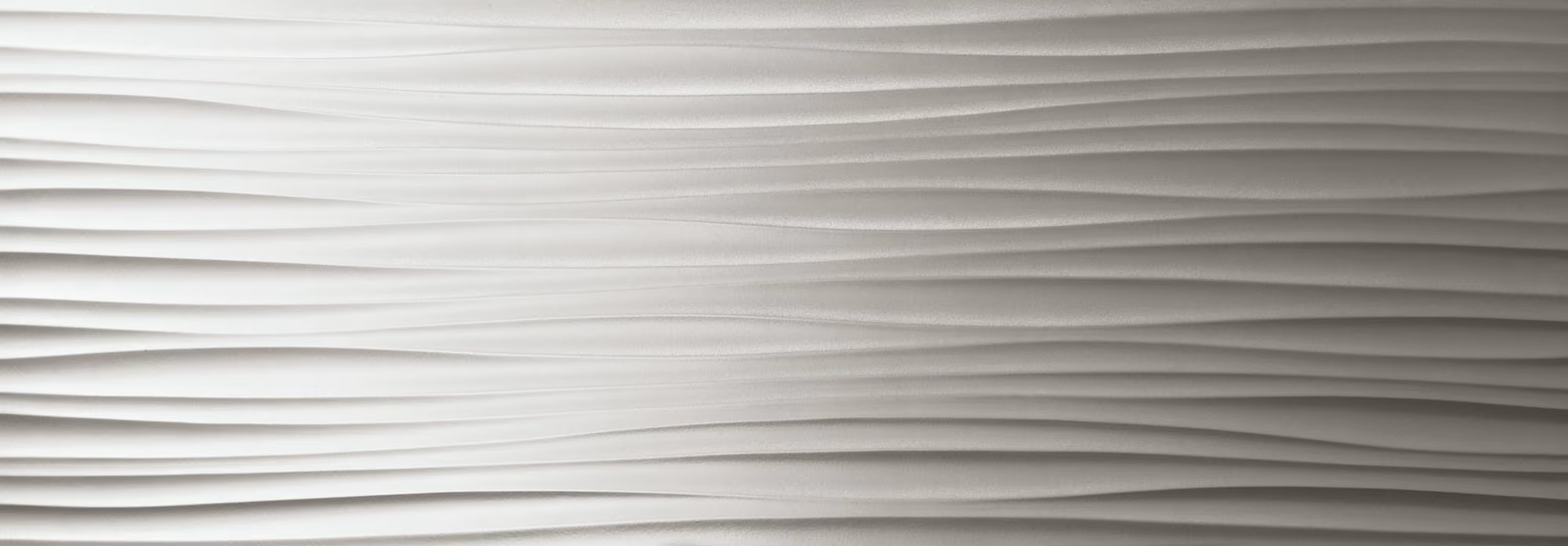 White textured surface with horizontal wave-like ridges creating a smooth flowing pattern.