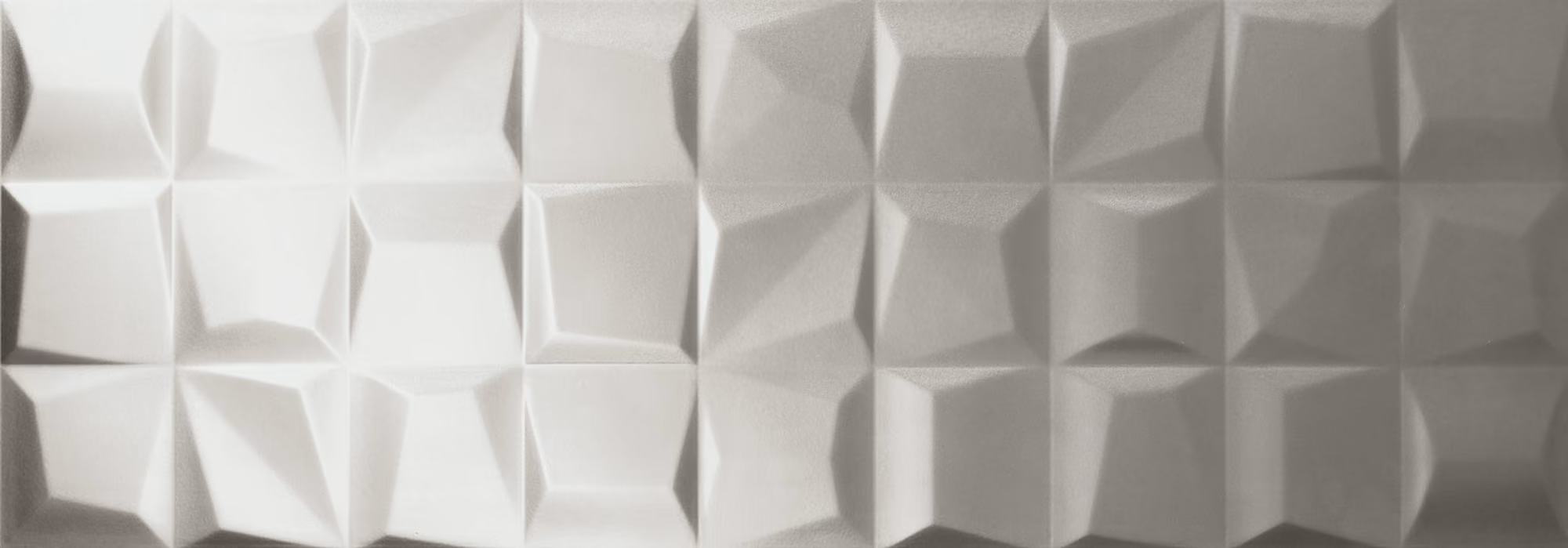 Textured wall panel with a 3D geometric pattern of raised, faceted squares in neutral tones.