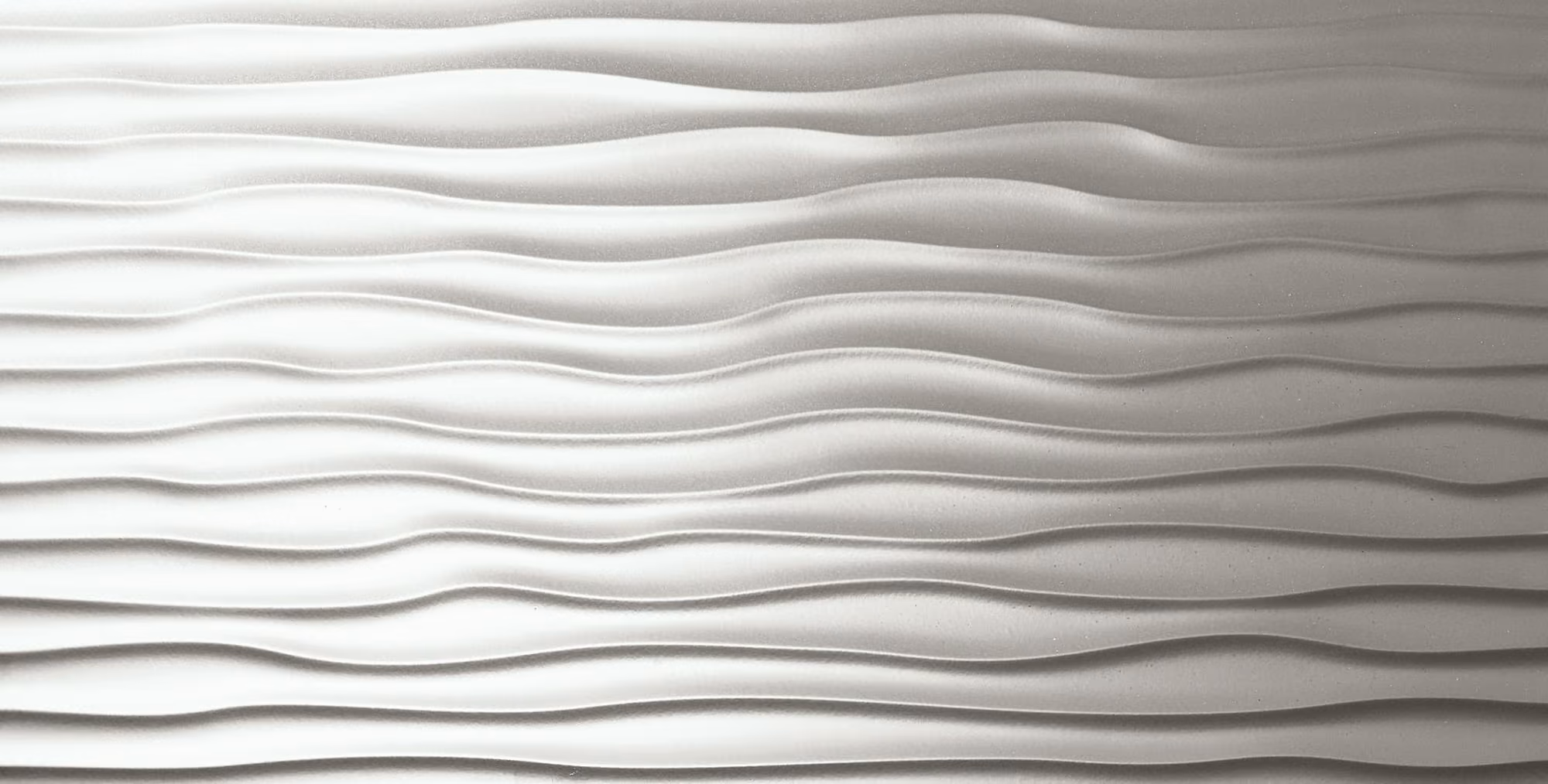 White textured surface with horizontal wavy ridges creating a ripple effect.