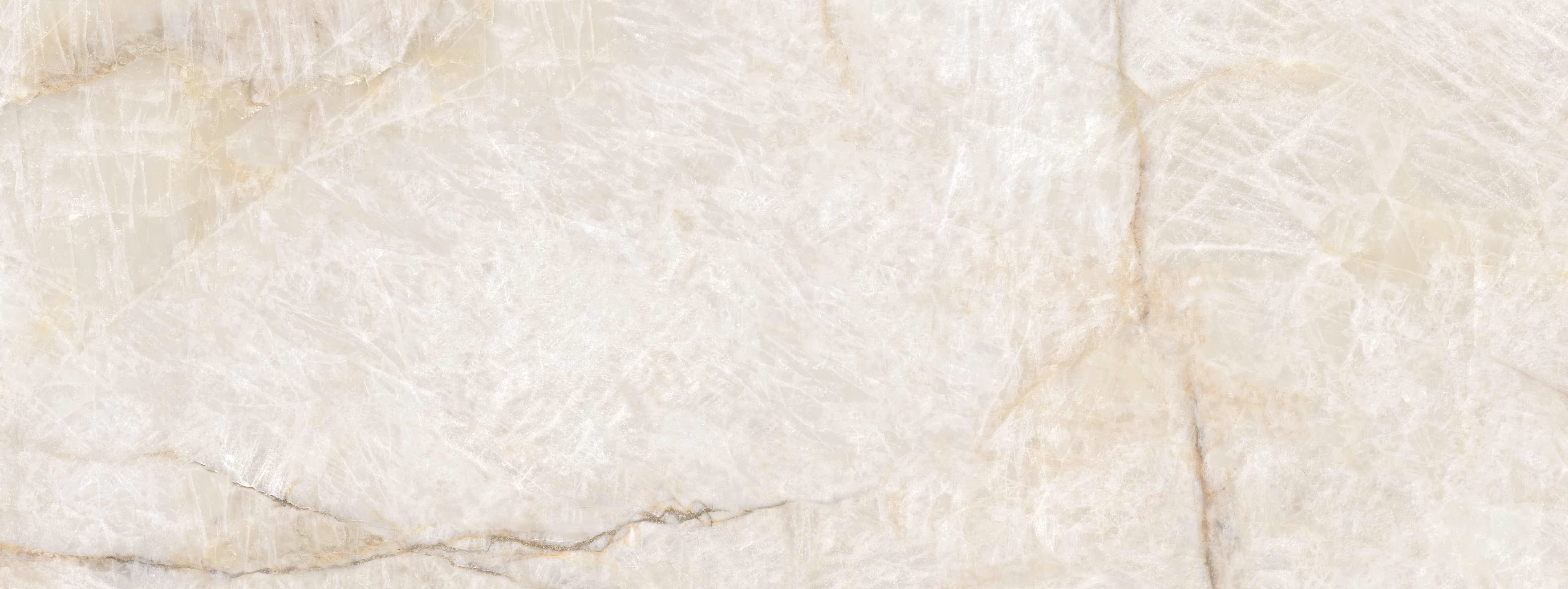 Close-up of a polished white marble surface with light beige and gray veining patterns.