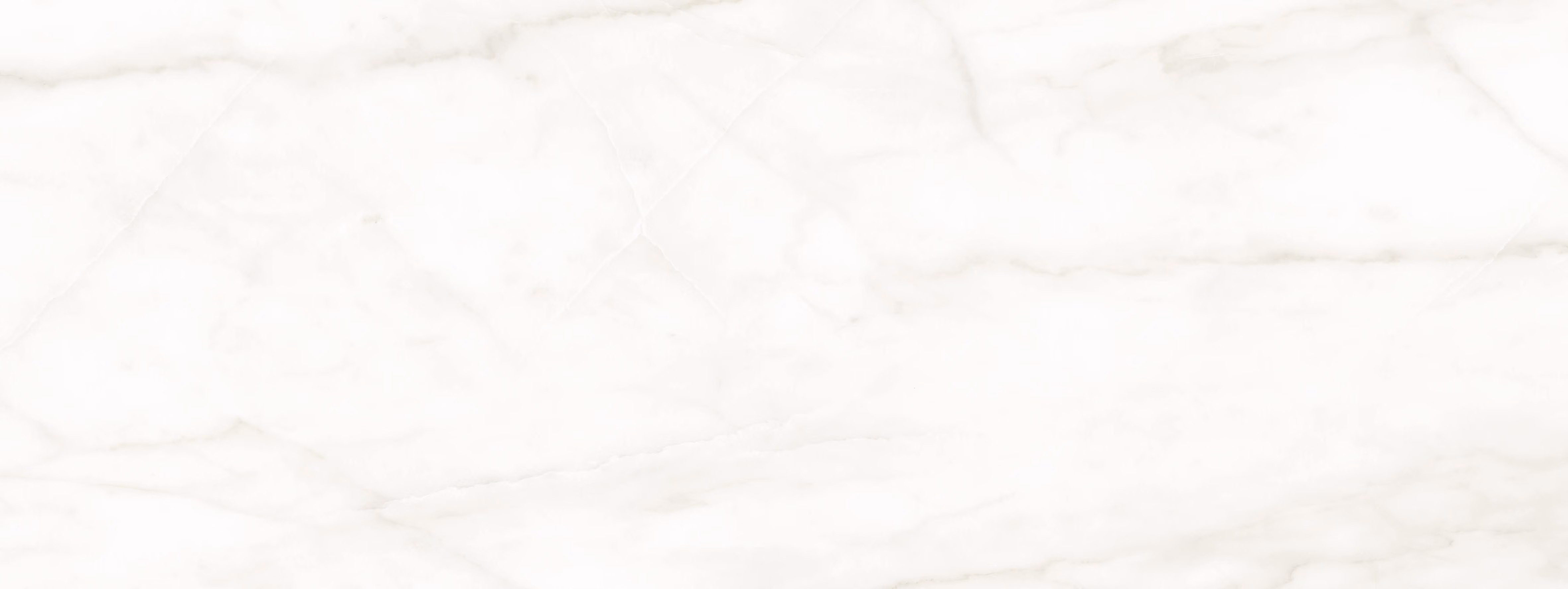 White marble slab with subtle grey and beige veining natural stone texture.