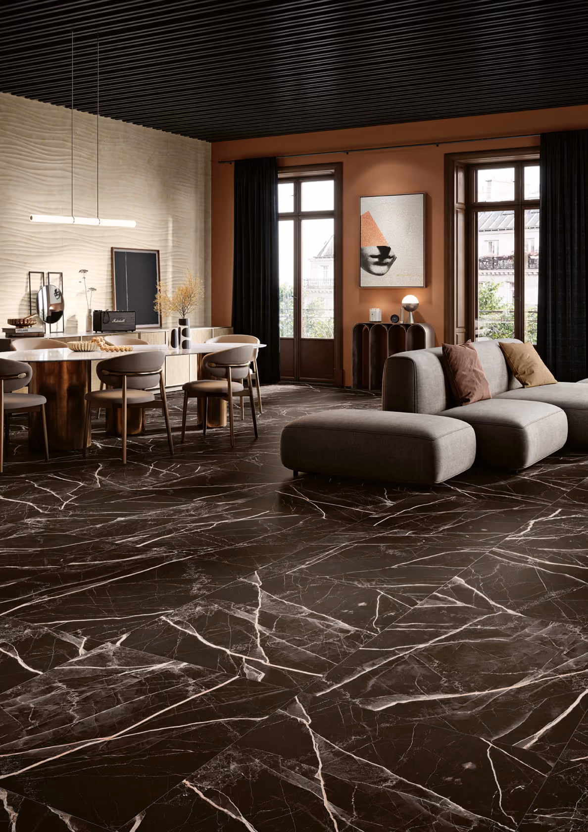 Modern living room with dark marble floor, gray sectional sofa, dining table, and large windows.