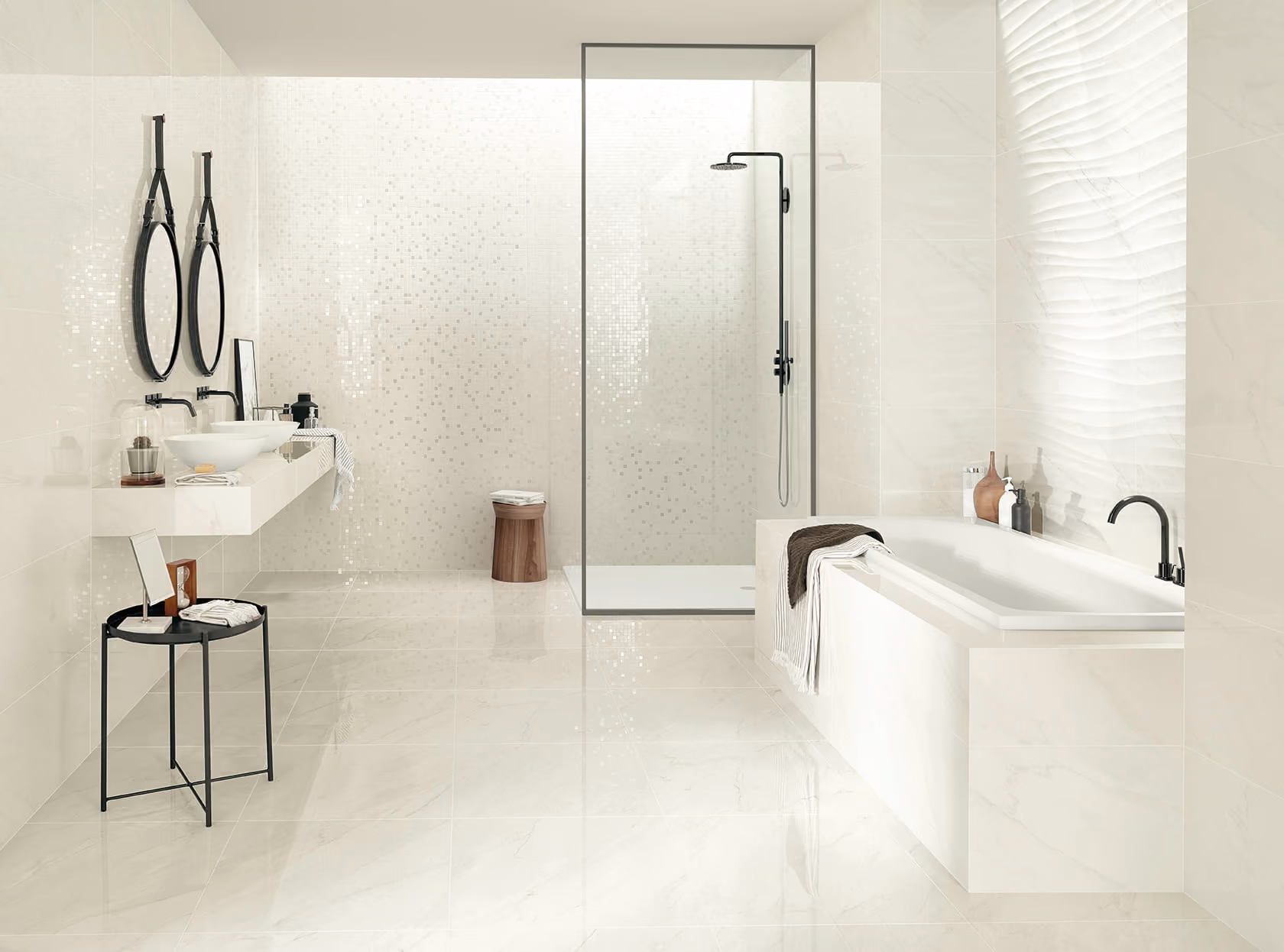 Modern white bathroom with double sinks, black round mirrors, bathtub, and glass shower enclosure.