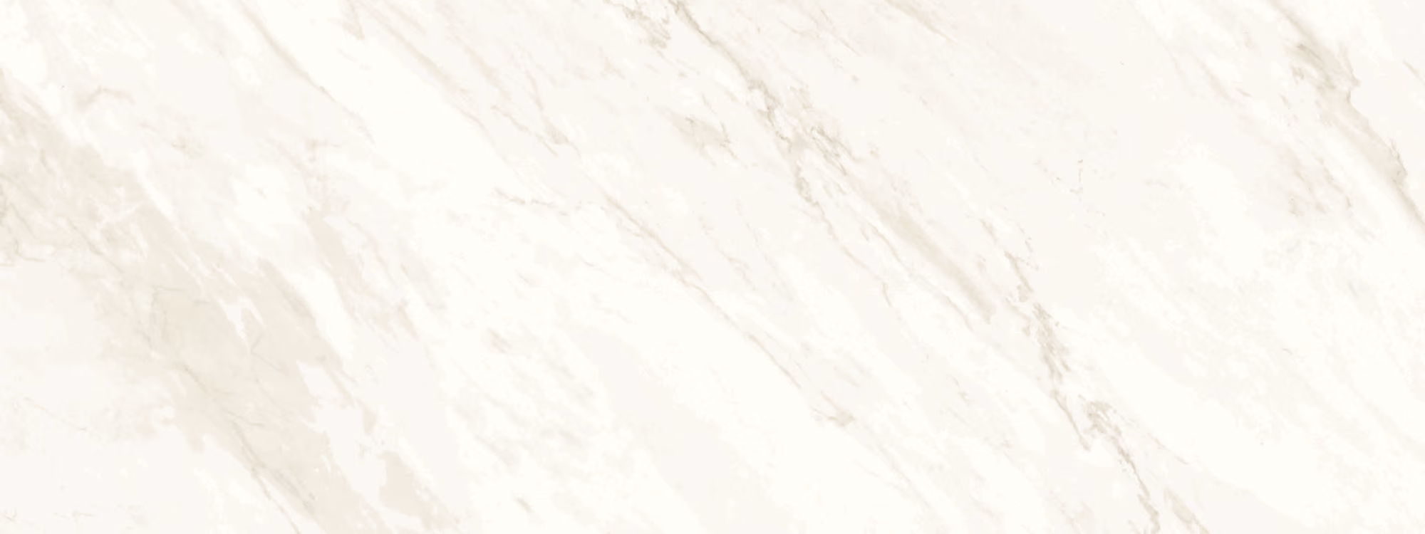 White marble surface with subtle light gray veining and soft natural texture.